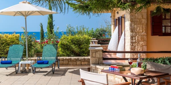 a patio with tables and chairs