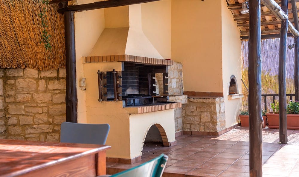 a room with a fireplace and a bench