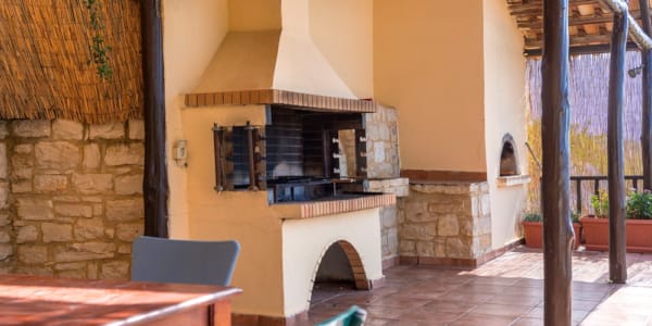 a room with a fireplace and a bench