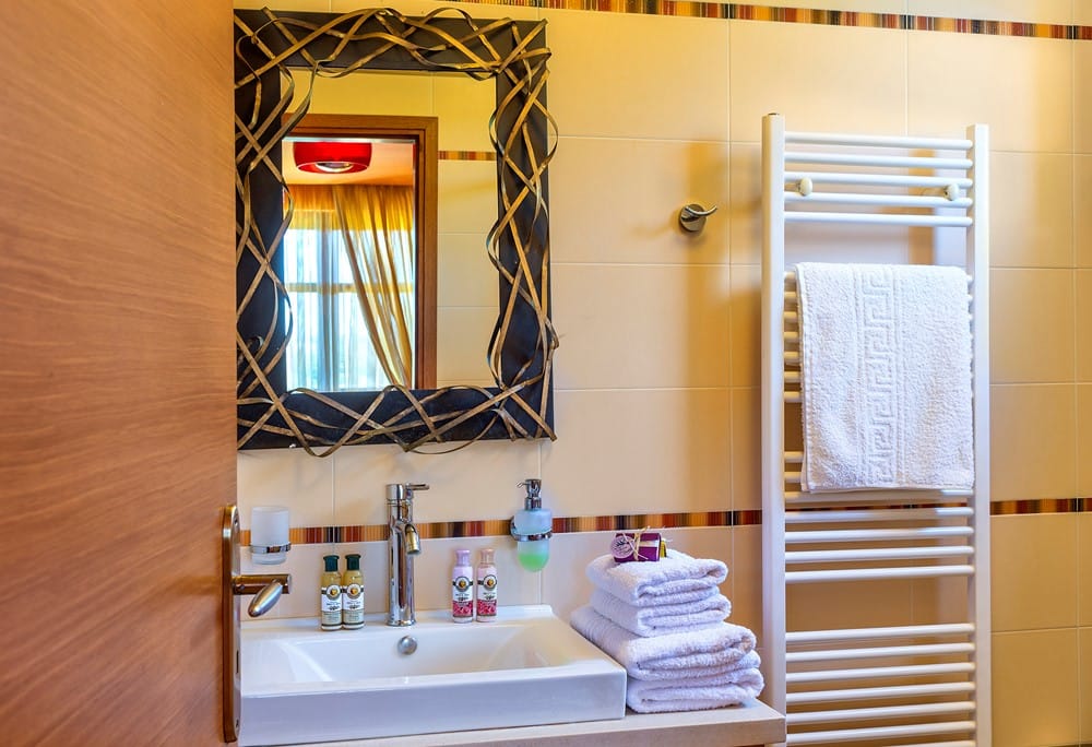 a bathroom with a mirror and sink