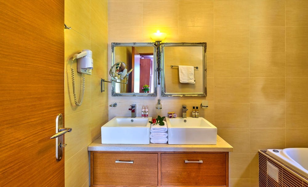 a bathroom with a mirror and sink