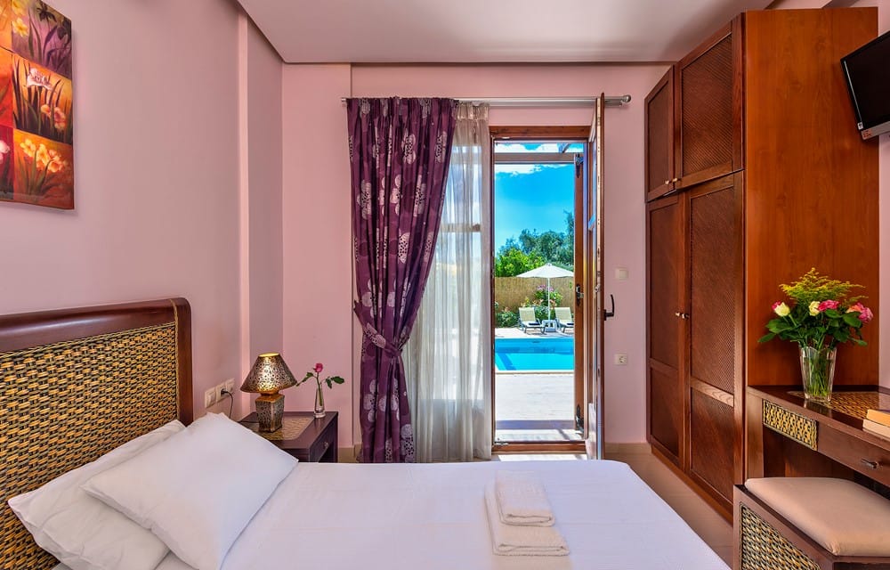 a bedroom with a large window