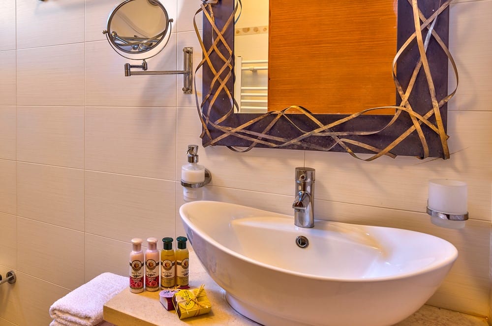 a bathroom with a sink and mirror