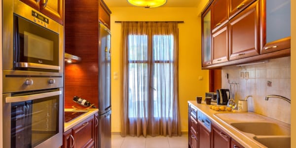 a kitchen with wooden cabinets