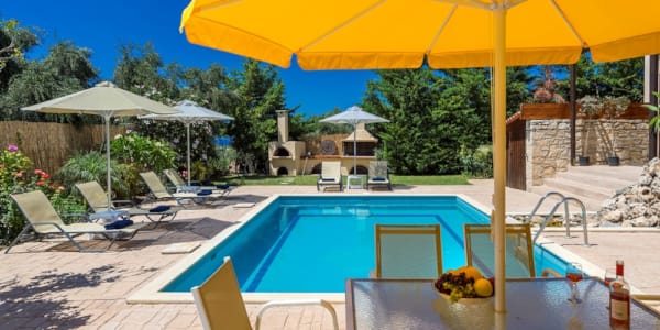 a pool with umbrellas and chairs
