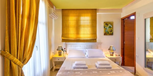 a hotel room with a bed and a couch