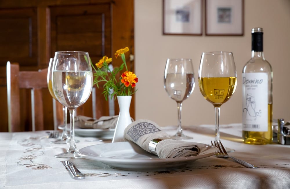wine glasses and a bottle of wine on a table