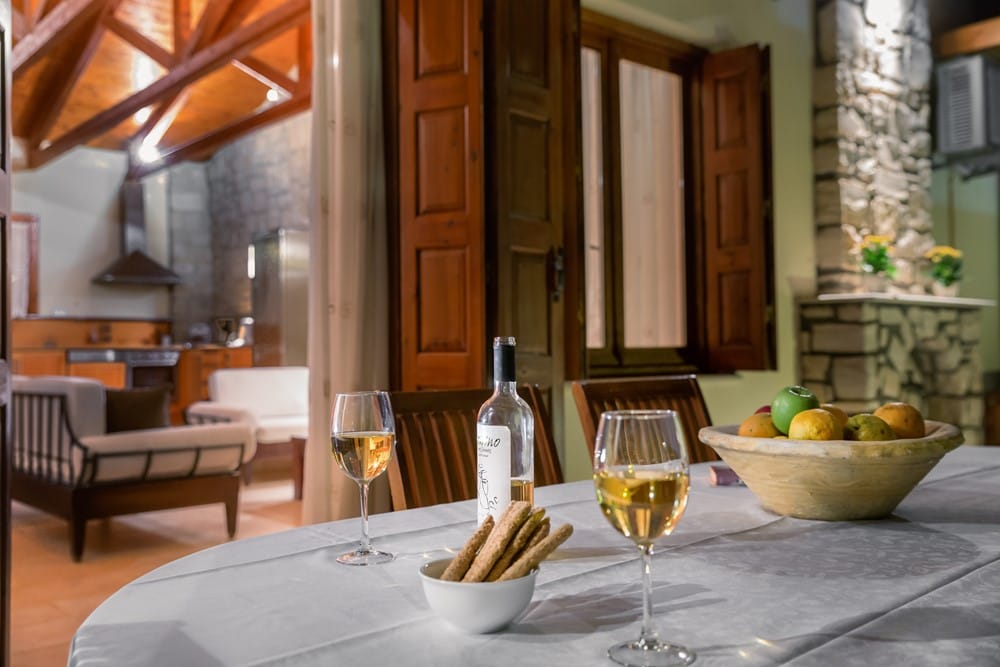 a table with wine glasses and food