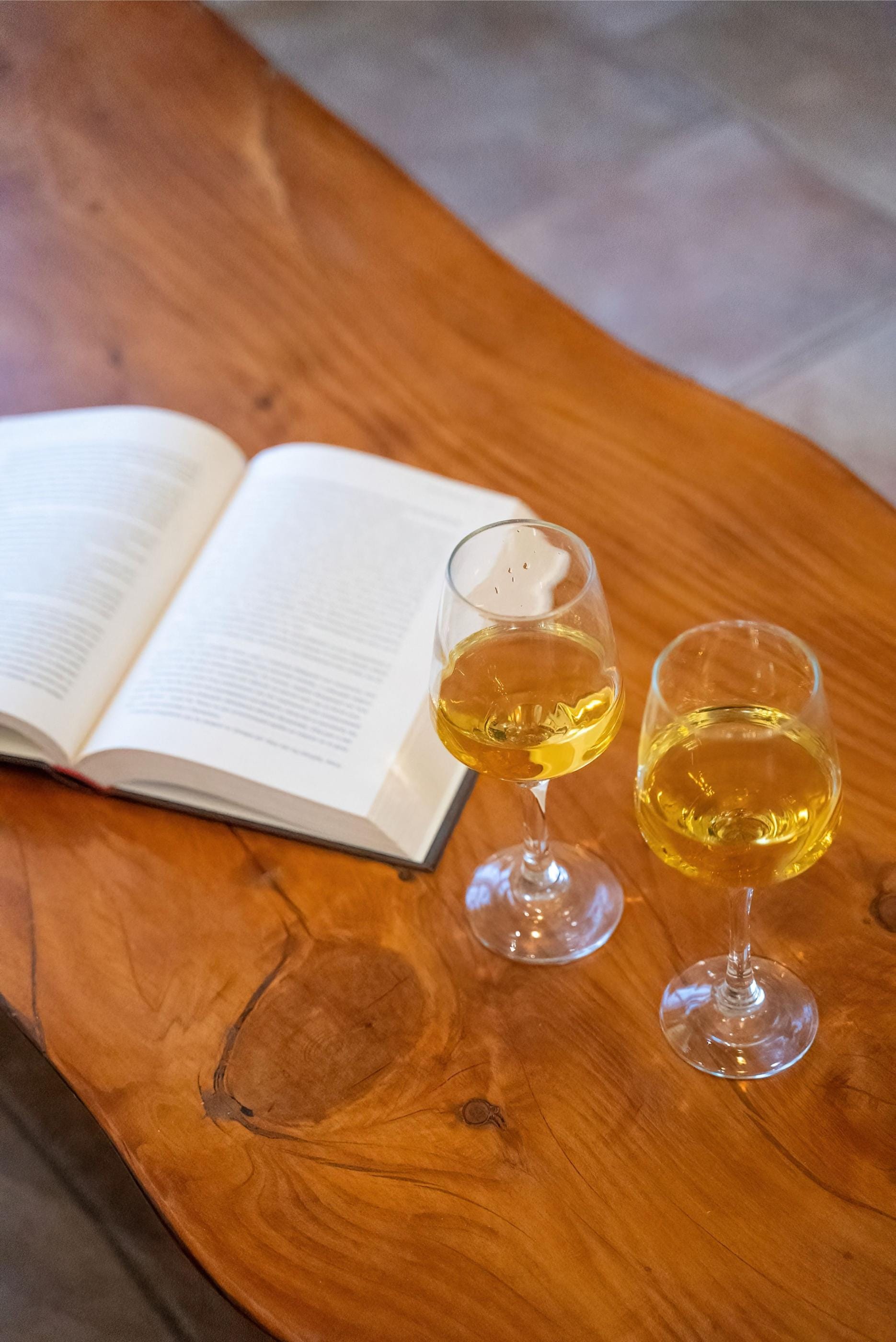 a couple of glasses of wine on a table