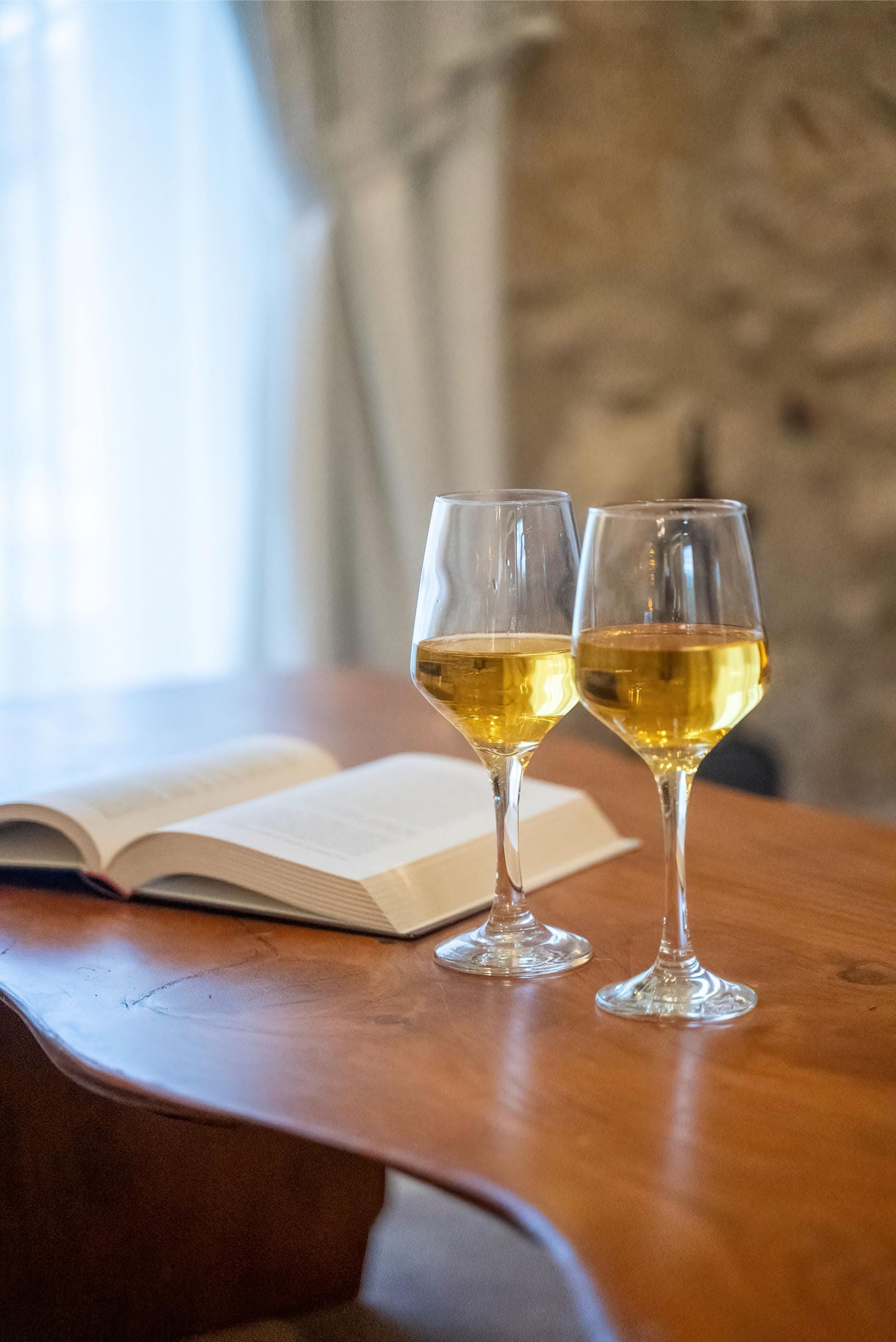 two glasses of wine on a table
