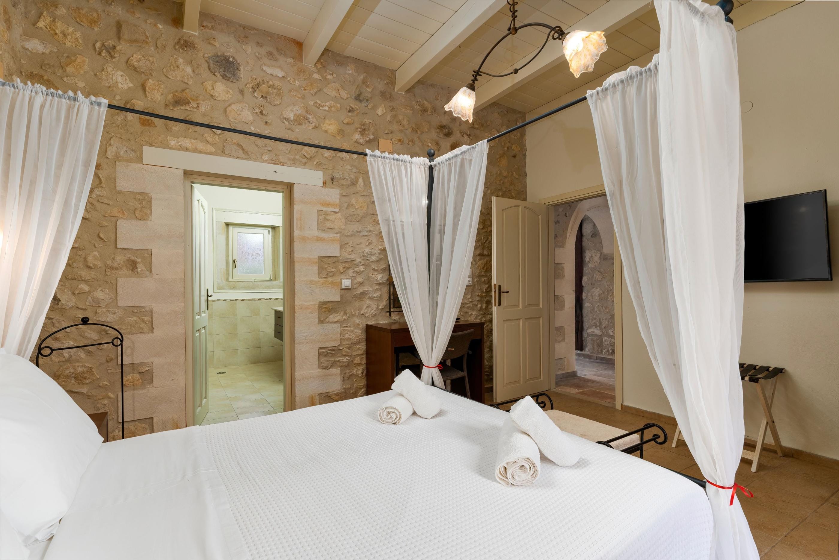 a bed with white sheets