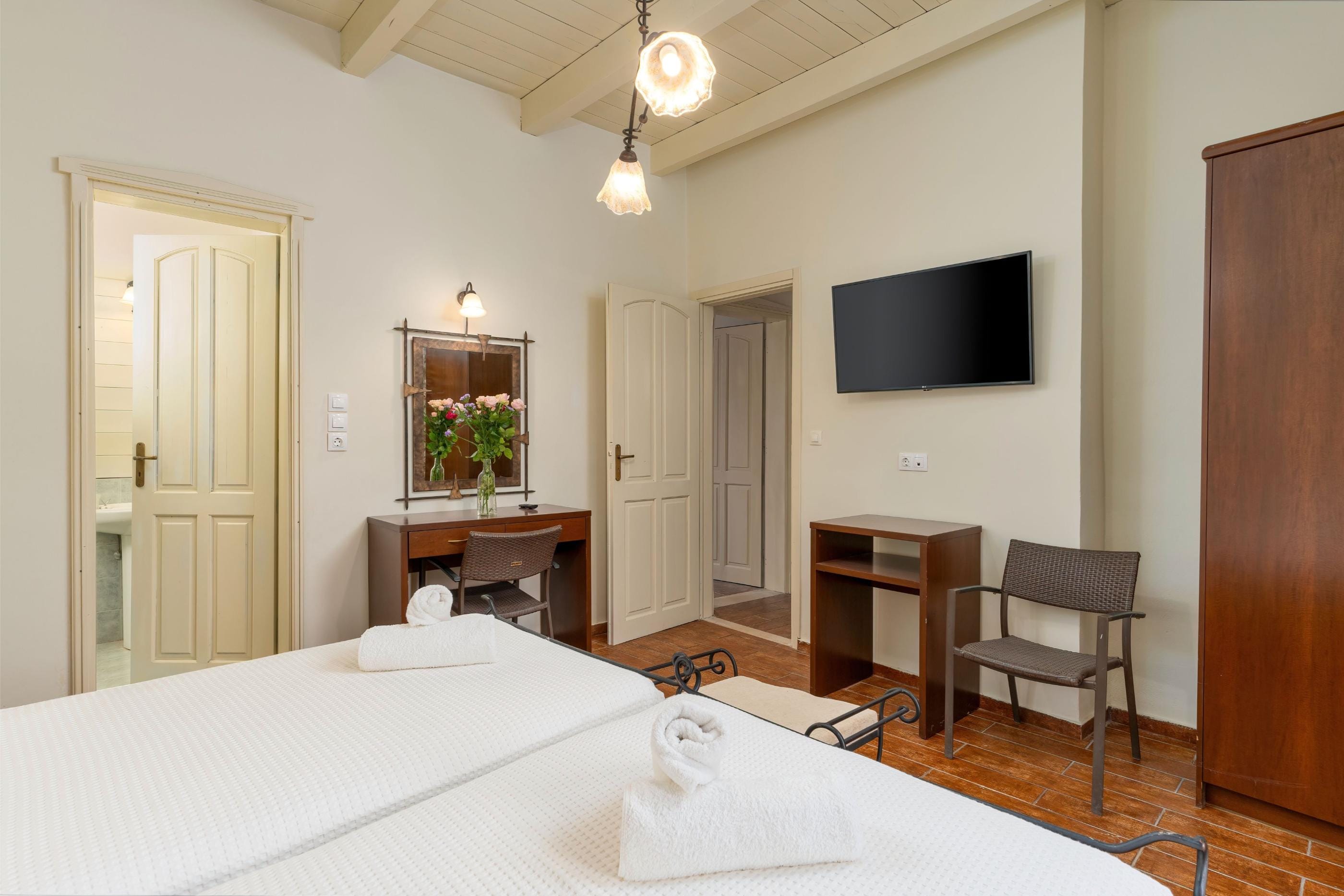 a room with a bed and a tv