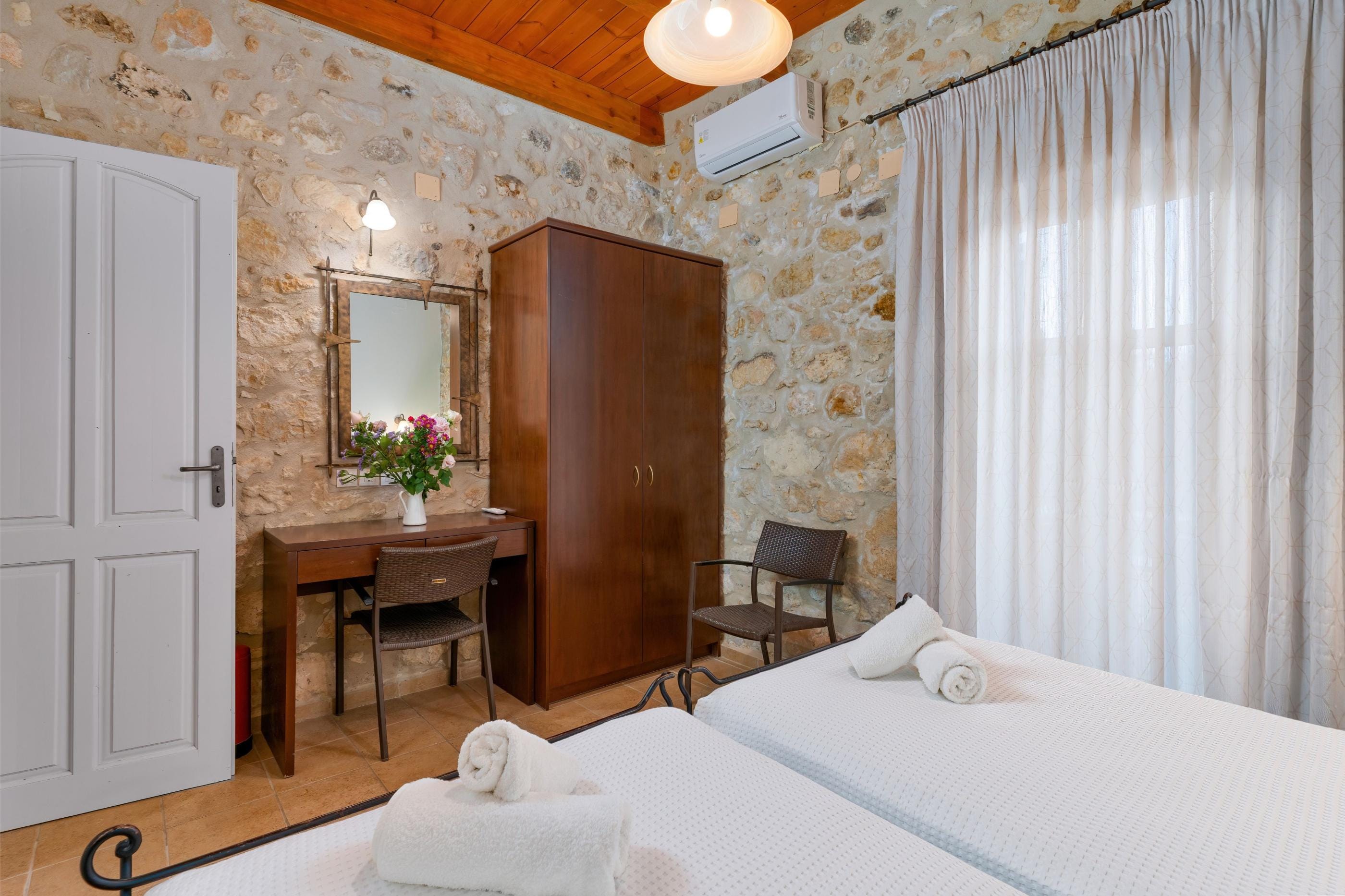 a room with a bed and a desk