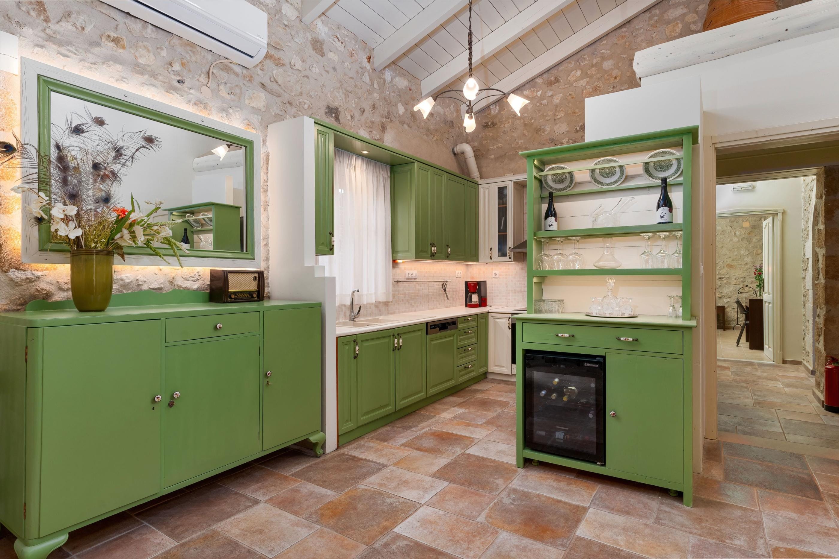 a room with green cabinets