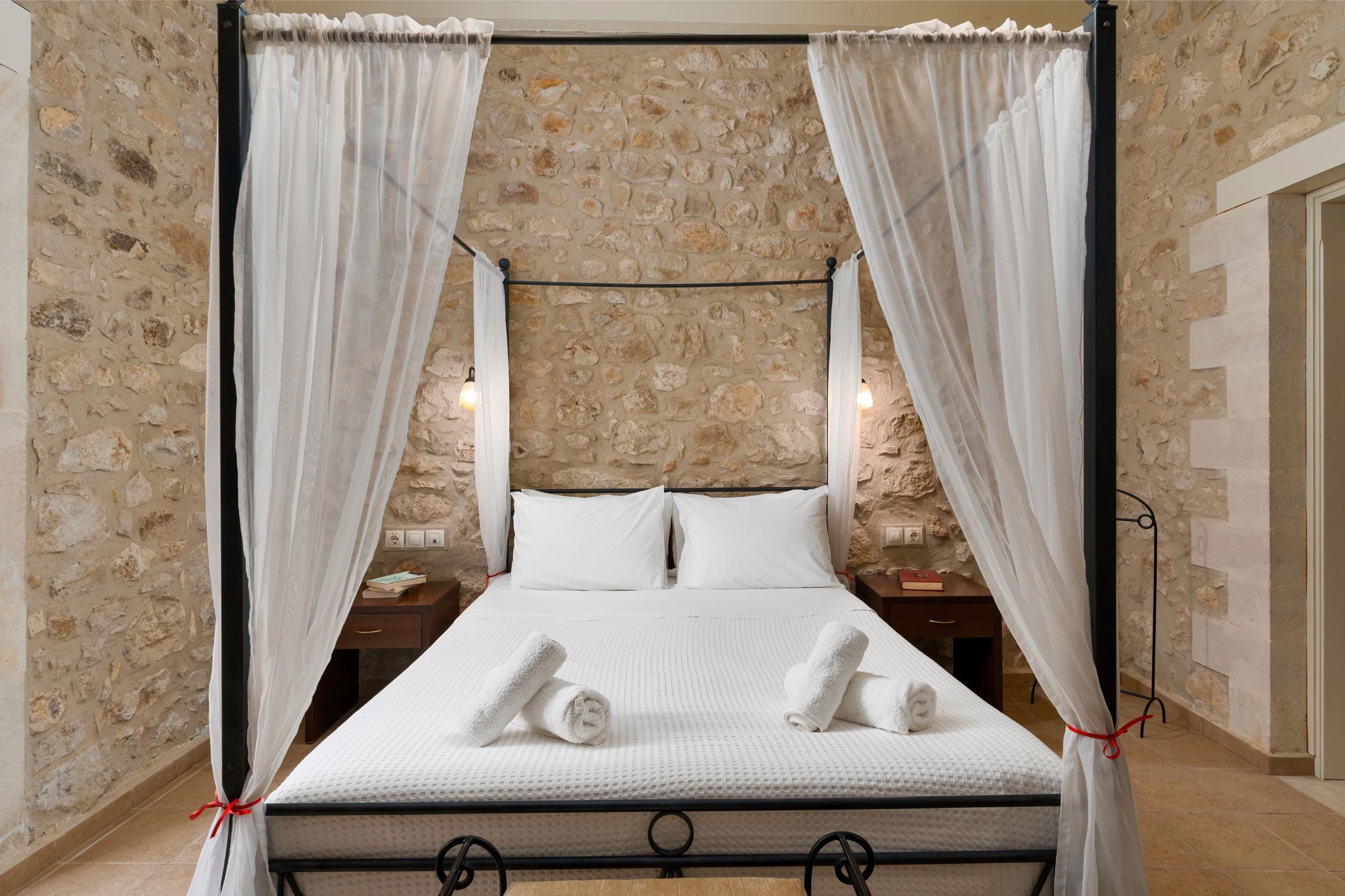 a bathtub with a white curtain