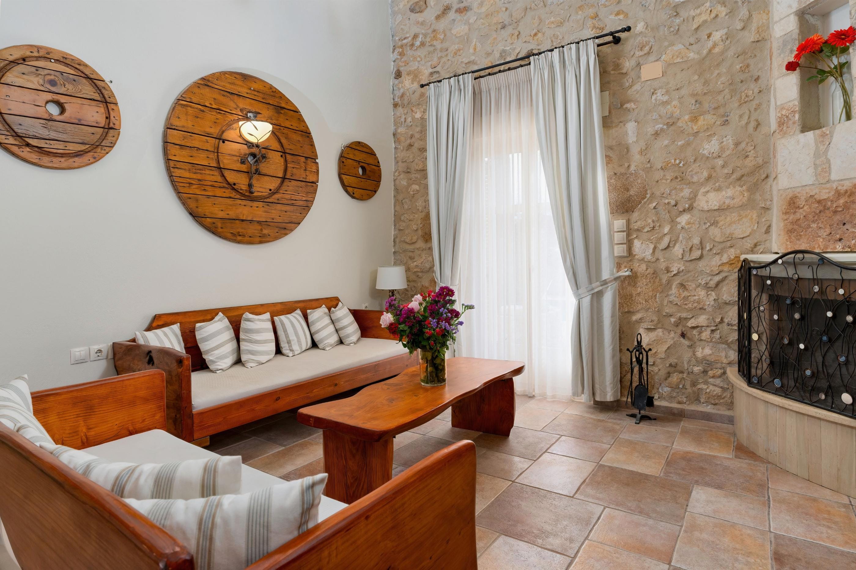 a room with a fireplace and couches