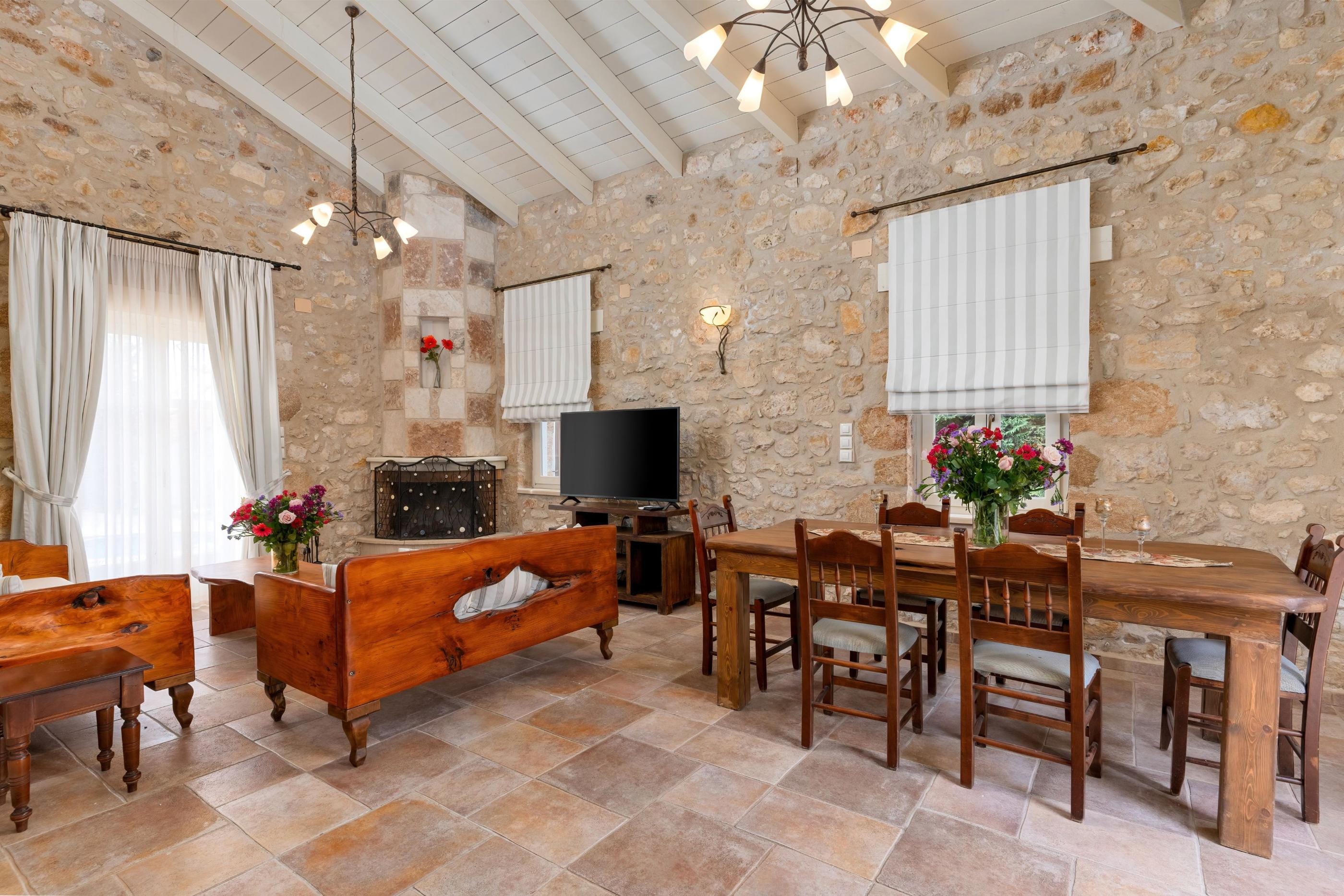 a large dining room with a tv and a fireplace
