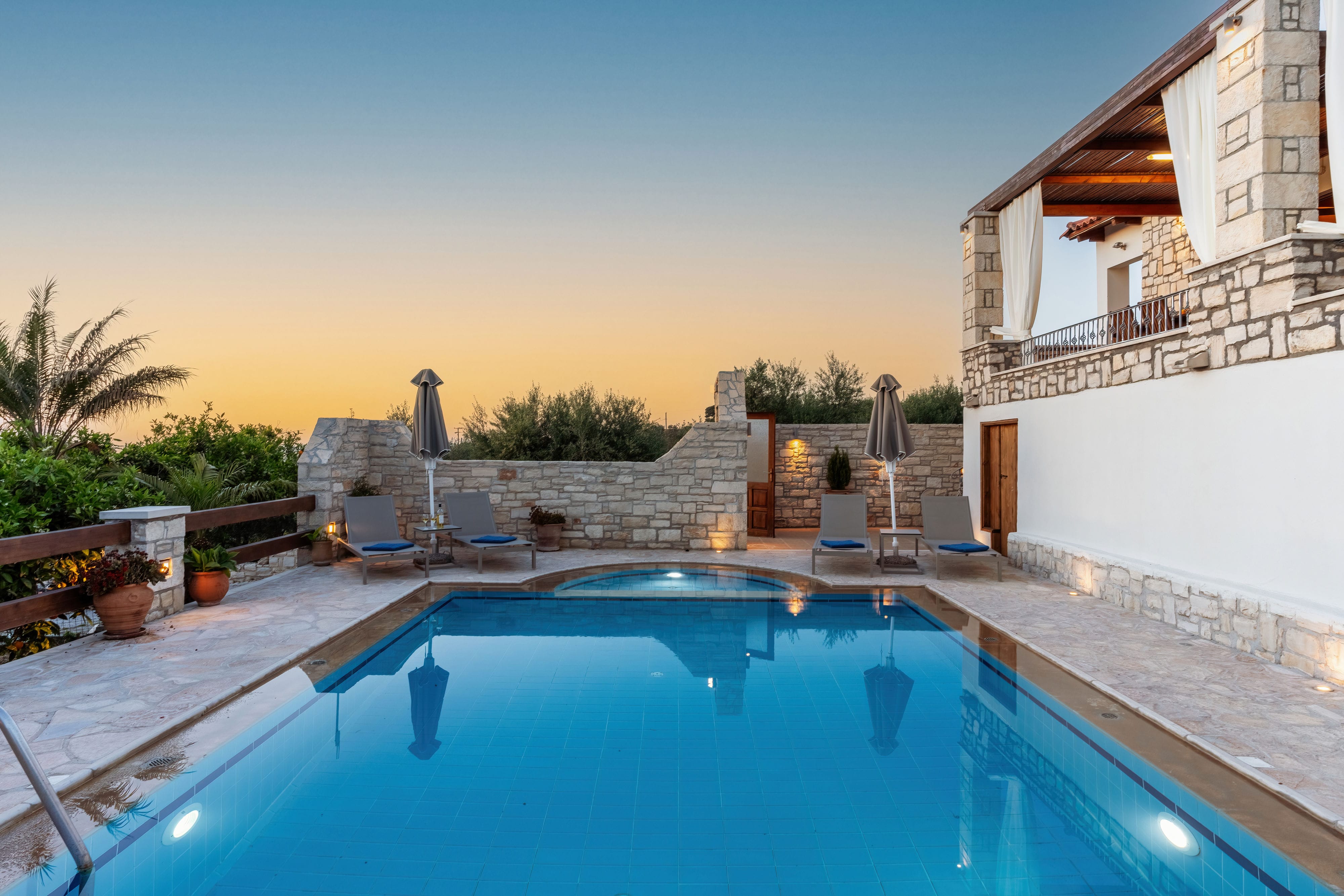 a swimming pool with a building in the background