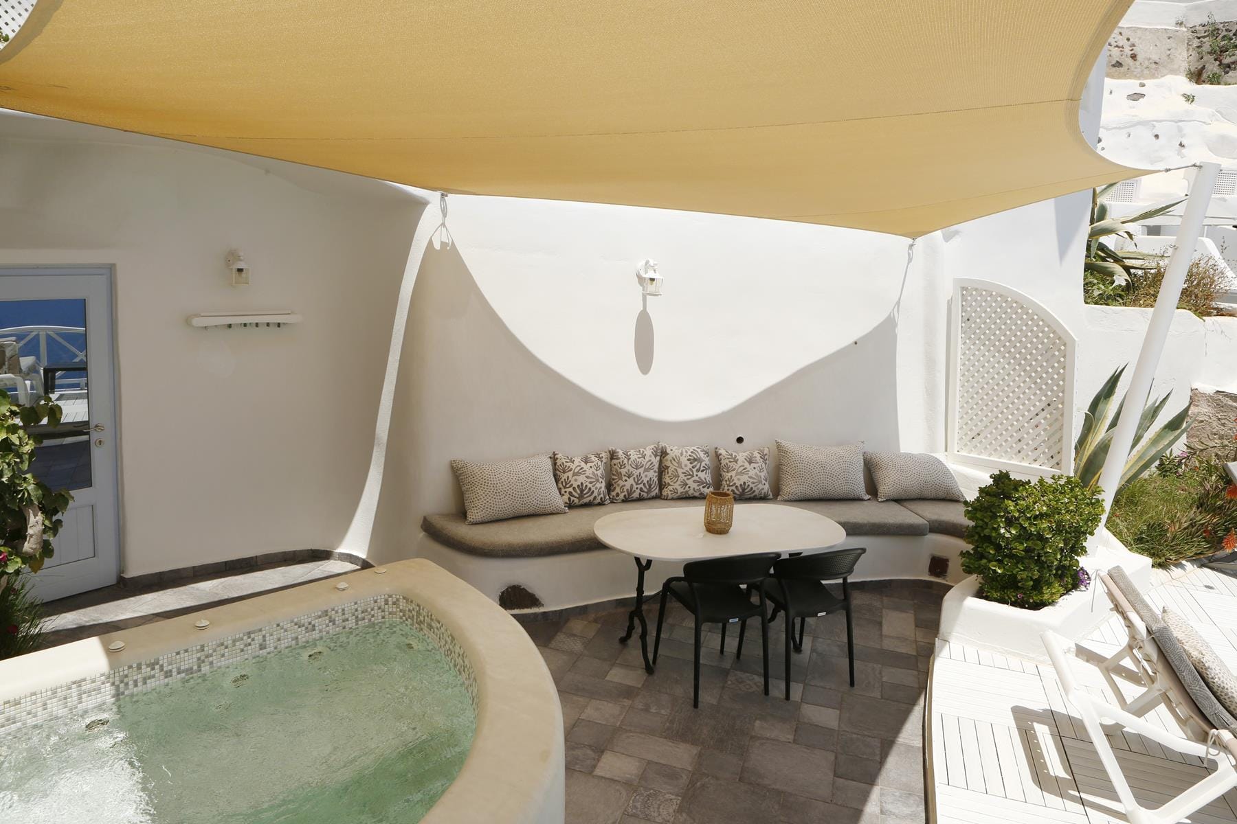 a room with a table chairs and a couch