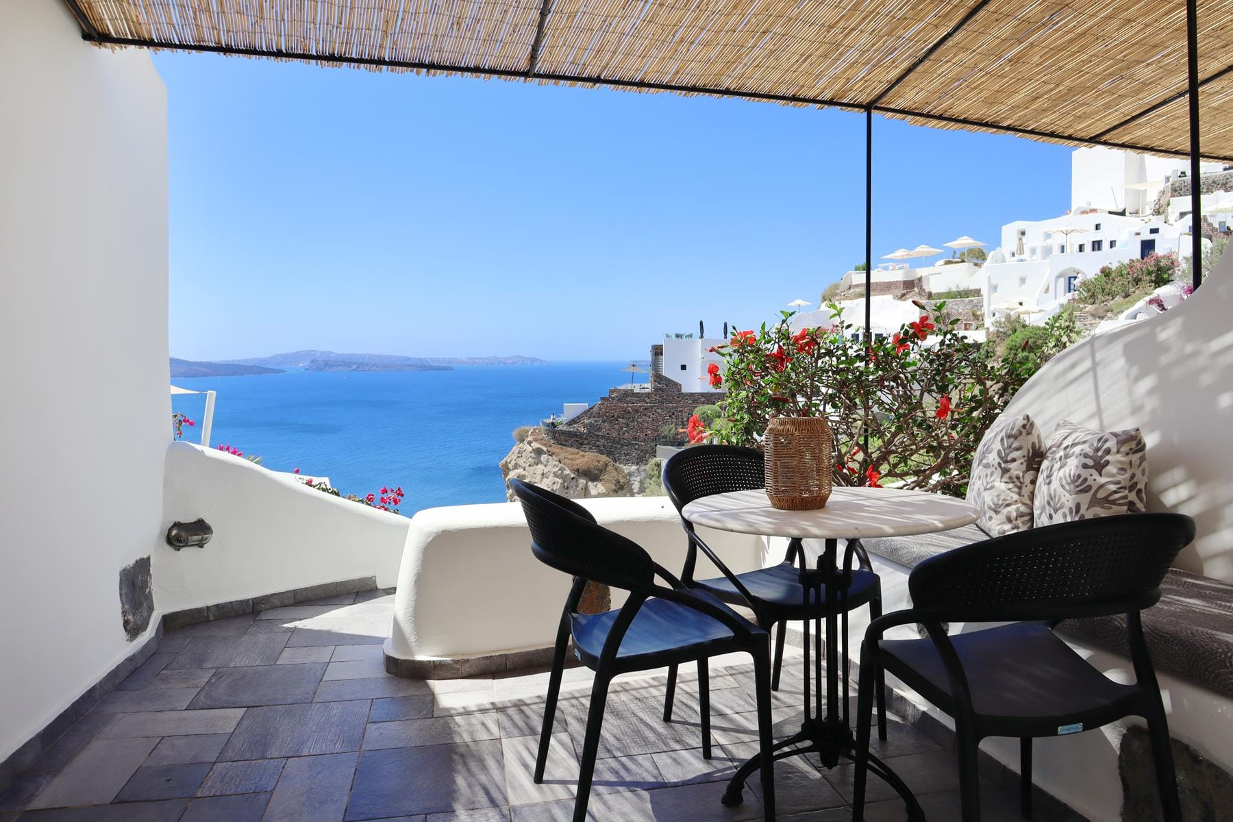 a table and chairs on a deck