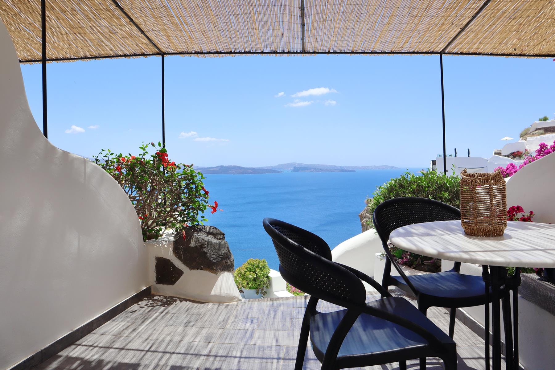 a table and chairs on a deck
