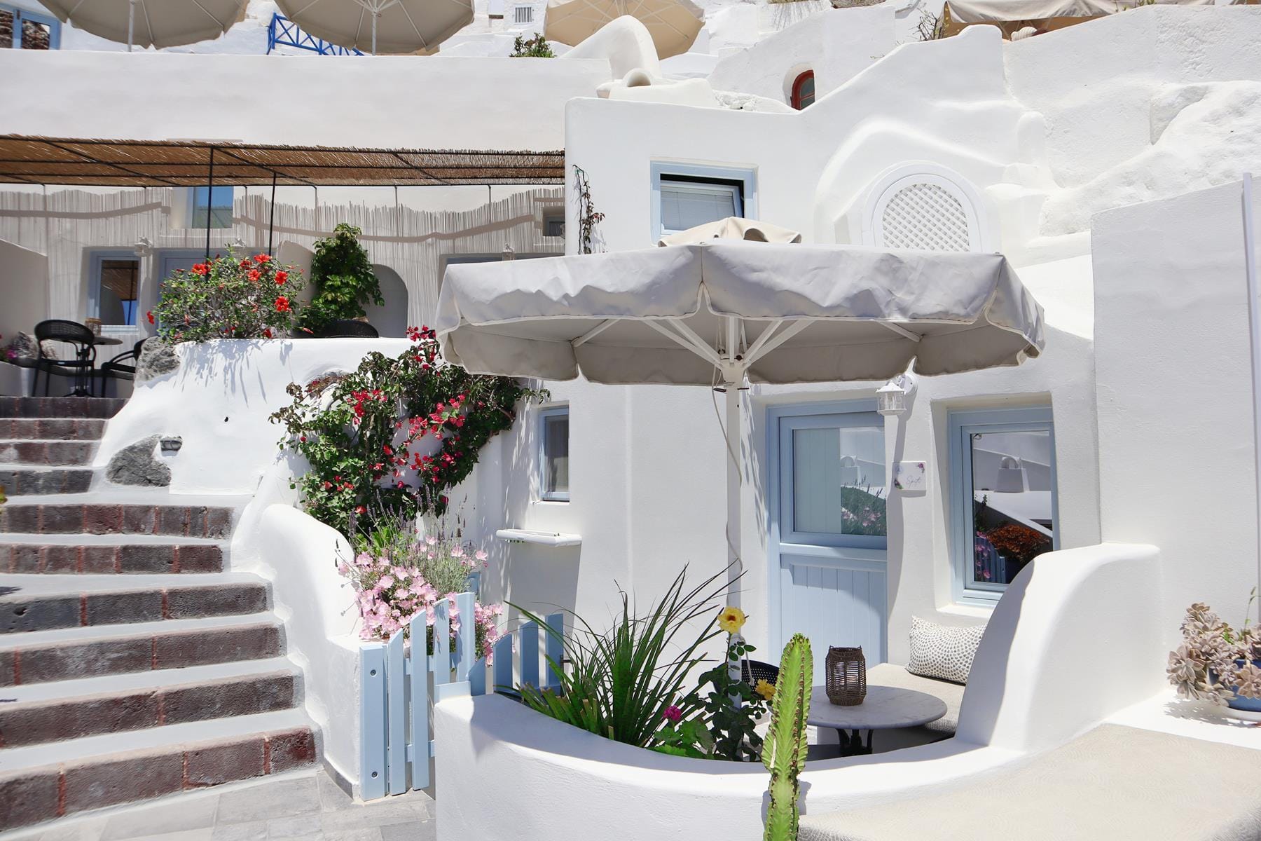 a white house with a white umbrella