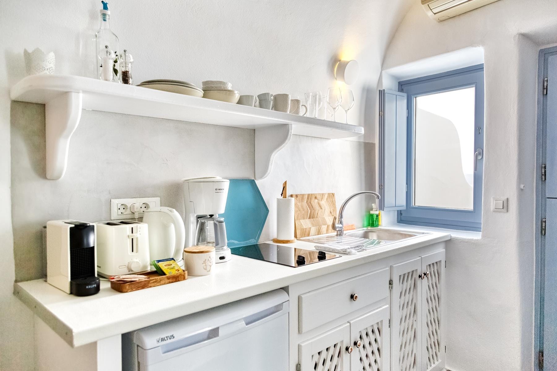 a kitchen with white cabinets