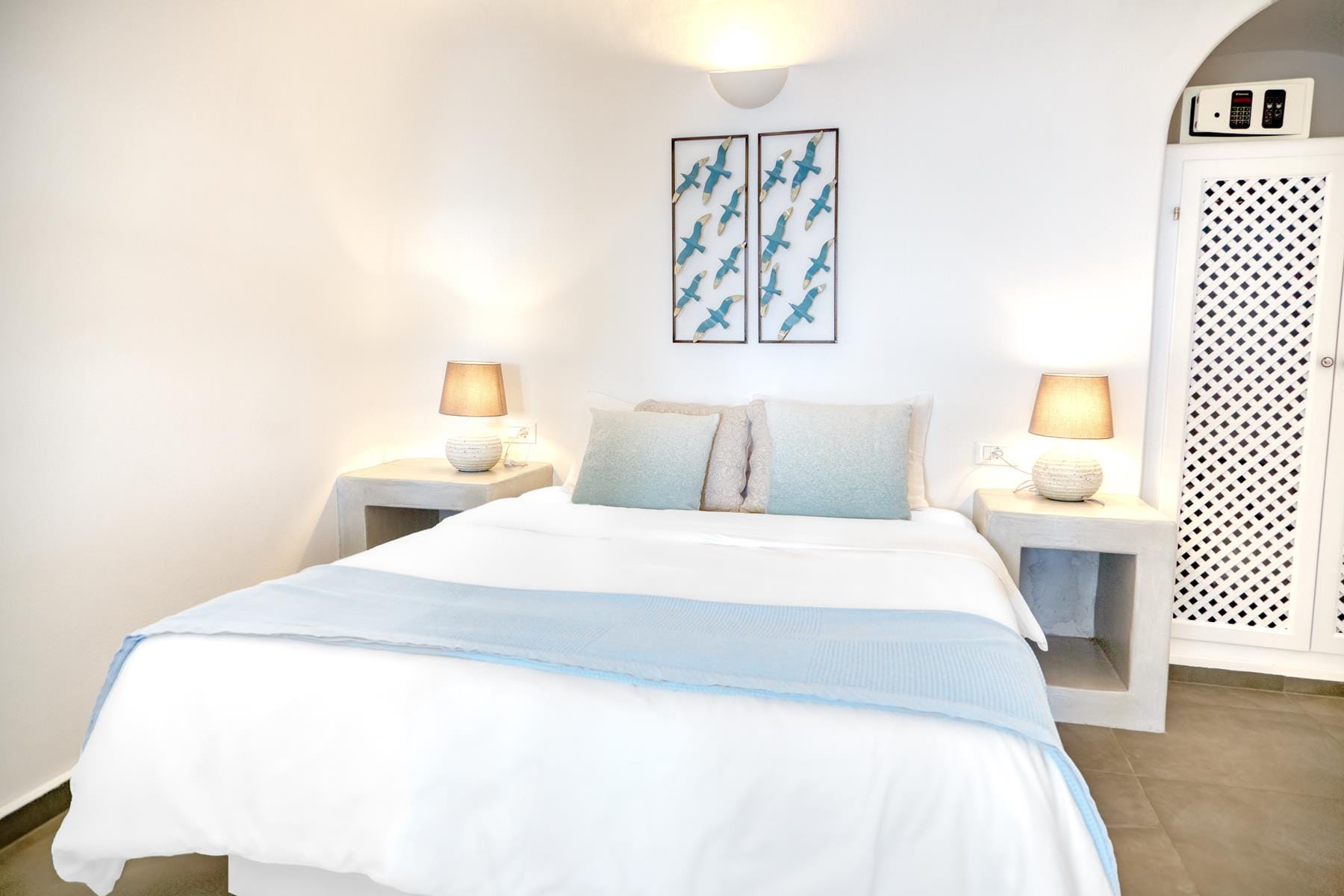 a bed with a white bed spread