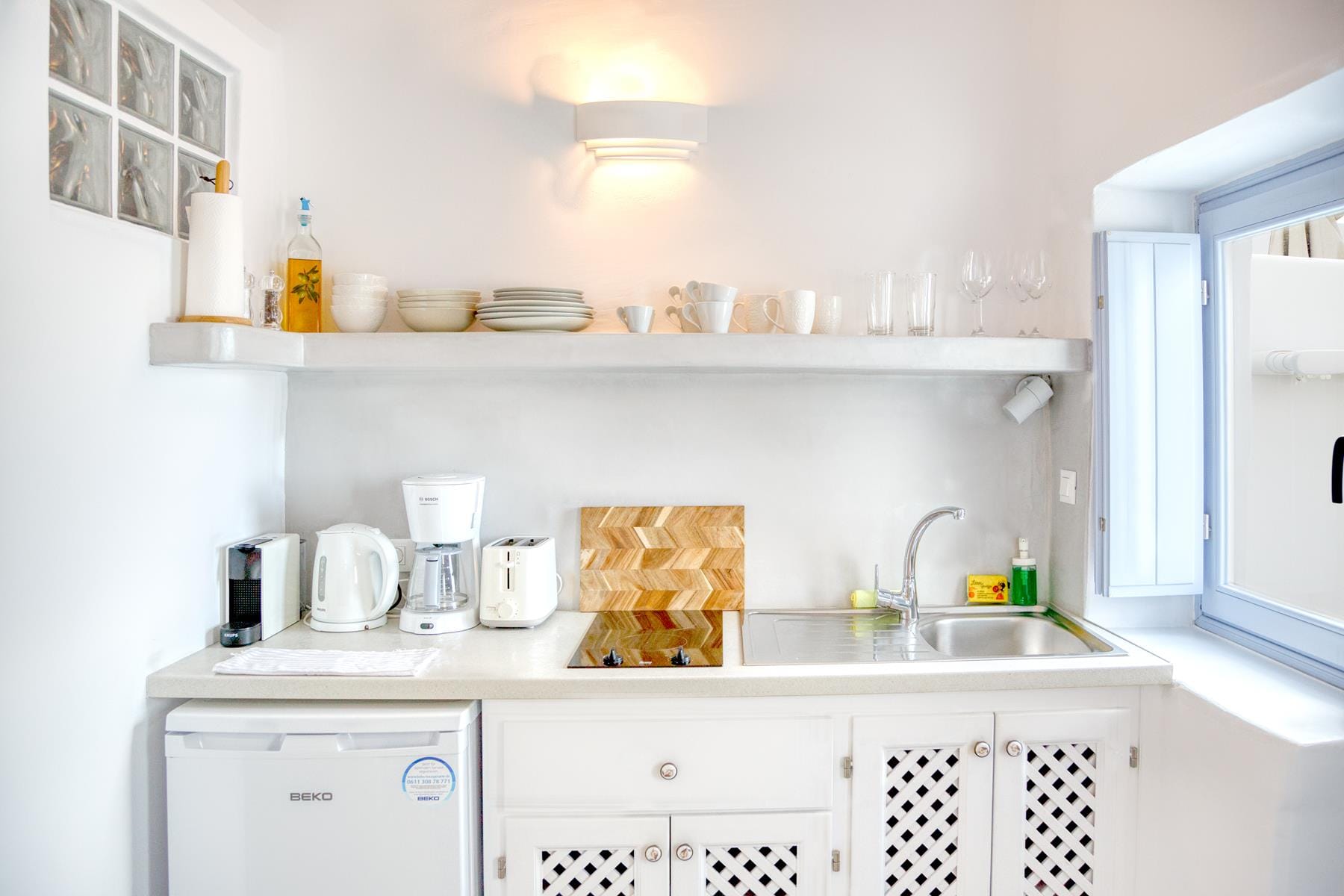 a kitchen with white cabinets