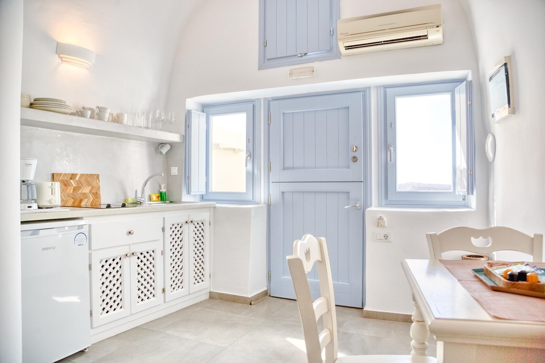 a kitchen with white cabinets