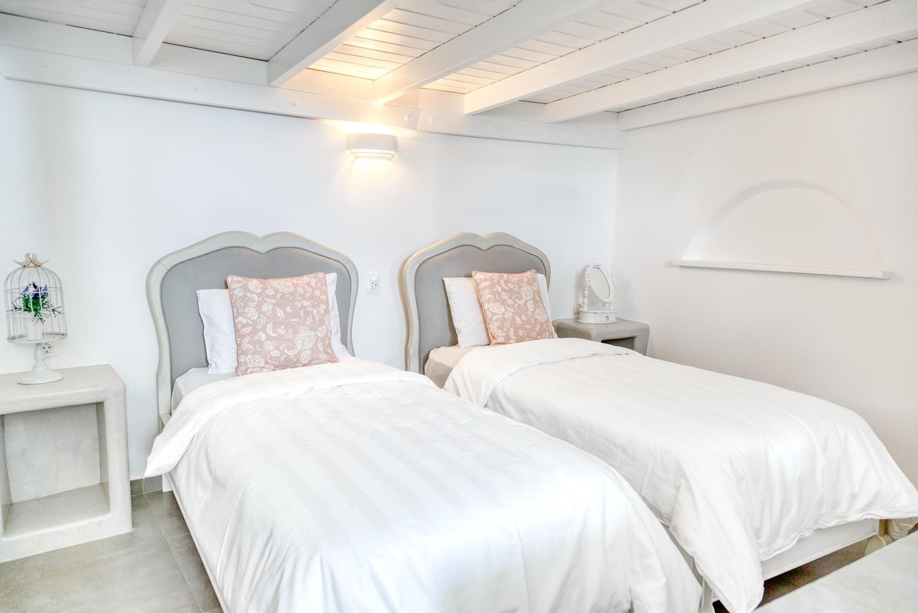 a couple of beds in a room