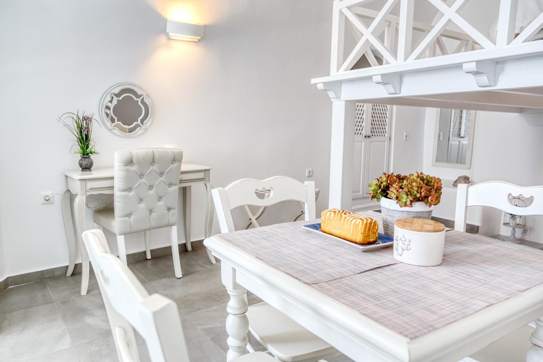 a table with chairs and a shelf