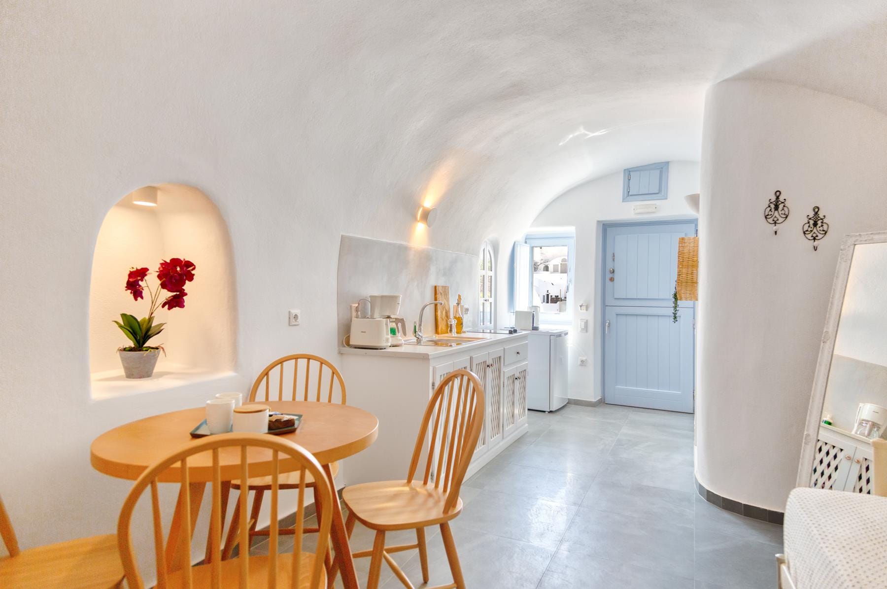 a dining room with a table and chairs