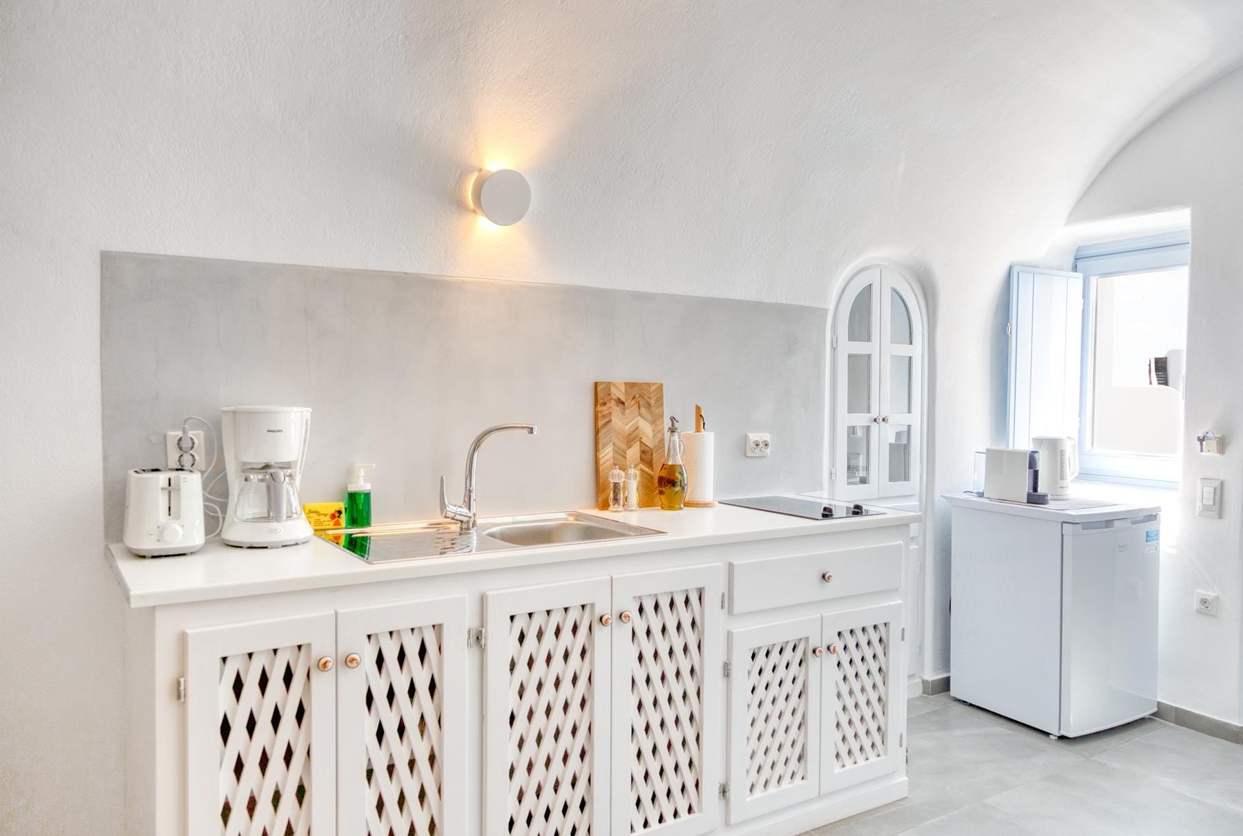 a kitchen with white cabinets