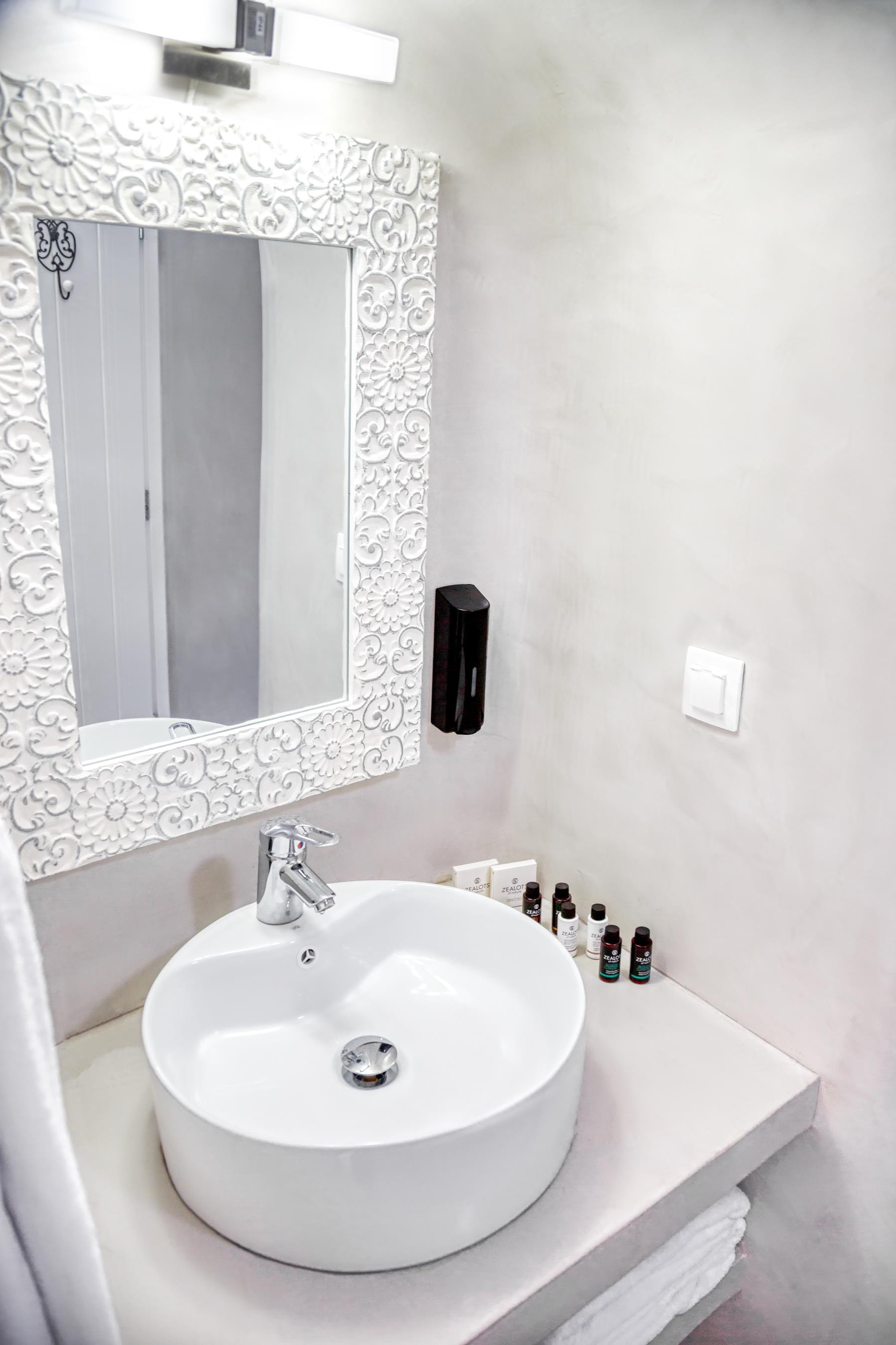 a bathroom with a mirror and sink