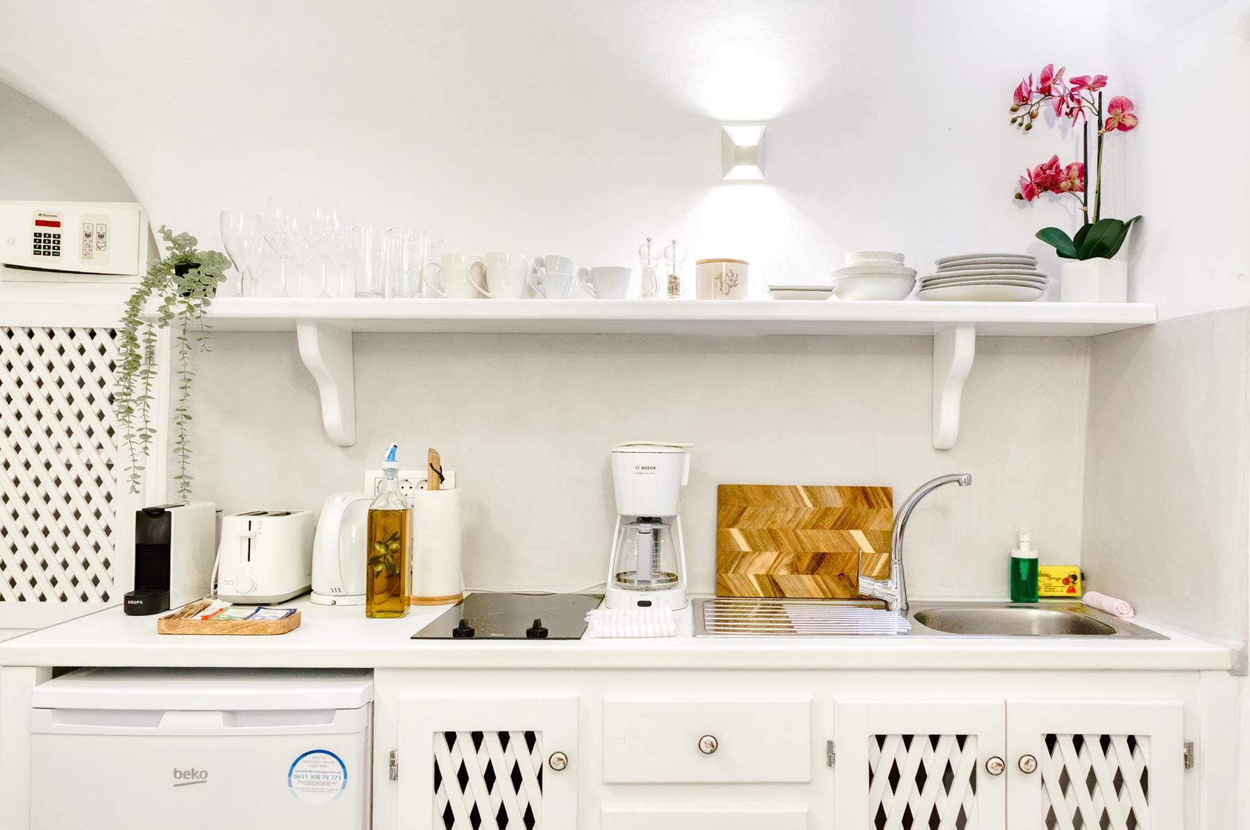 a kitchen with white cabinets