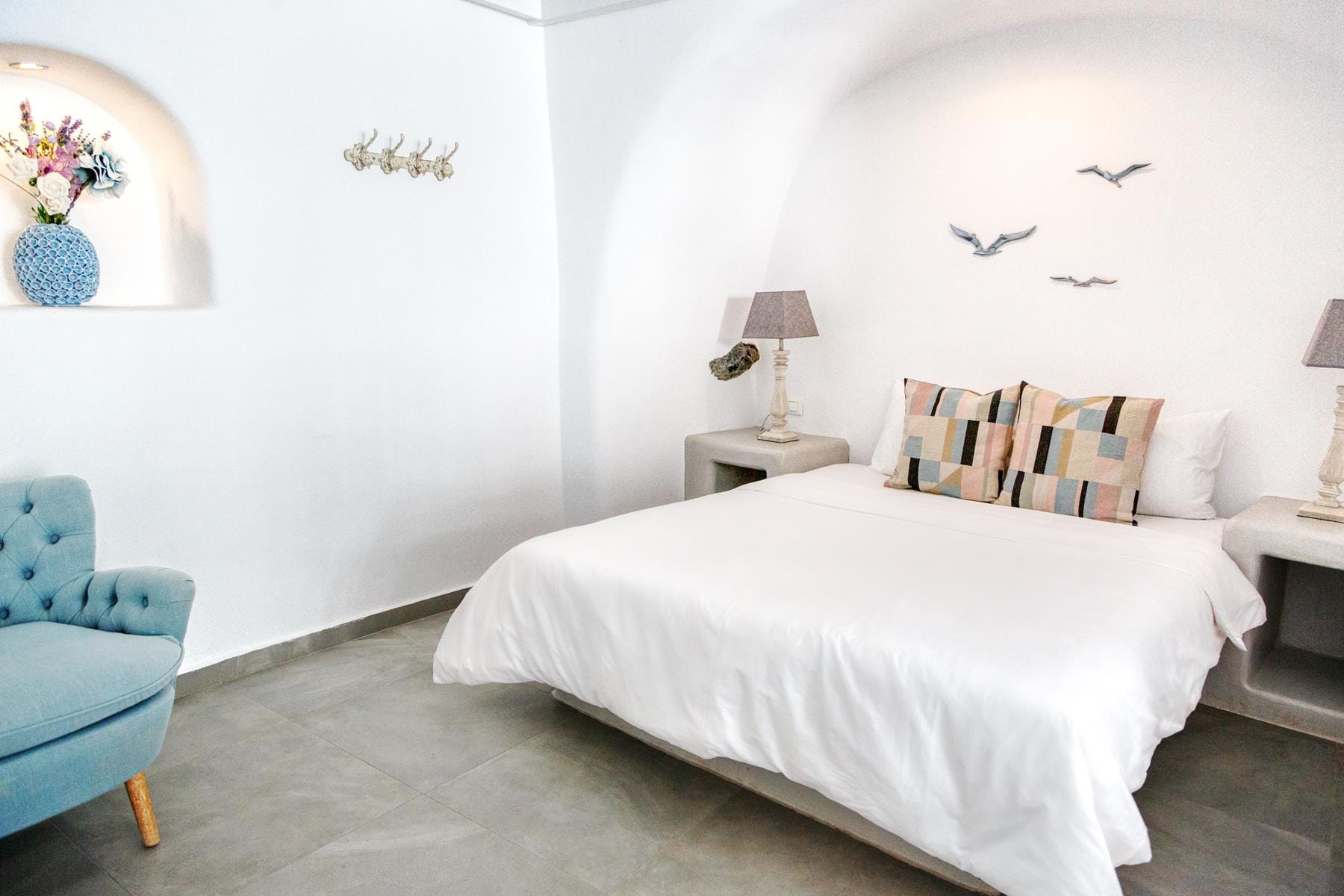 a bedroom with a bed and a chair