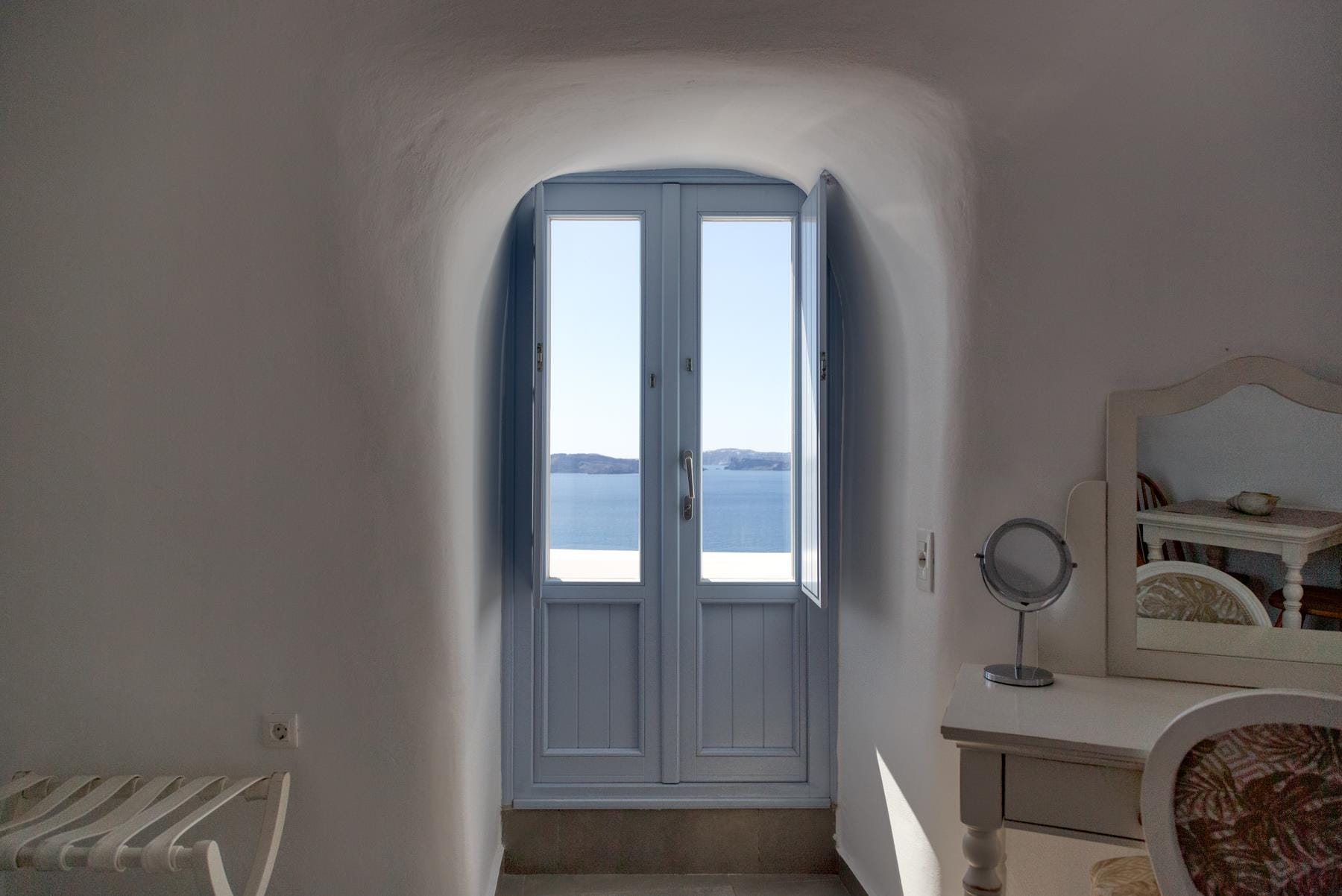 a room with a door and a lamp