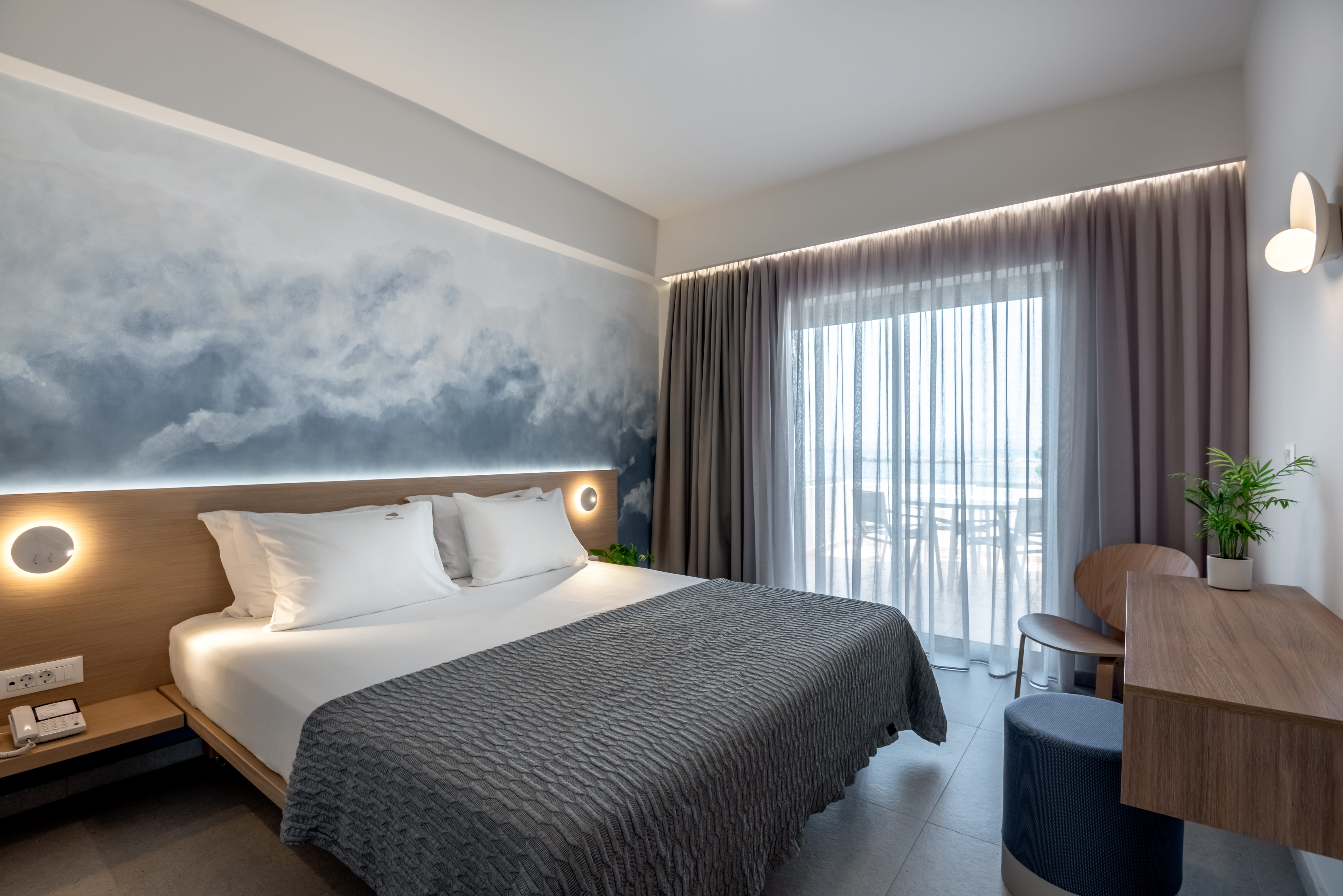 a bedroom with a bed and a desk