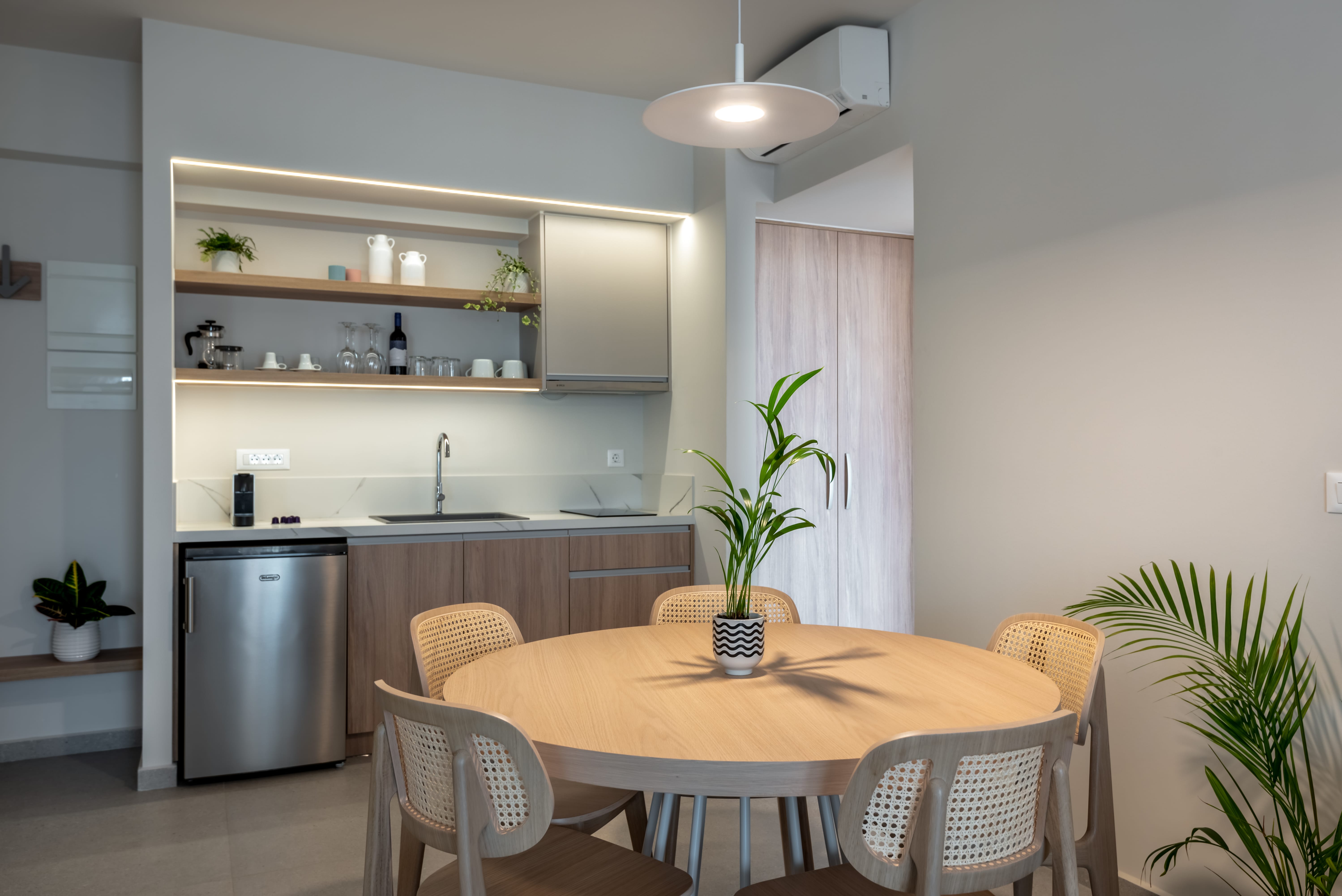 a kitchen with a table and chairs