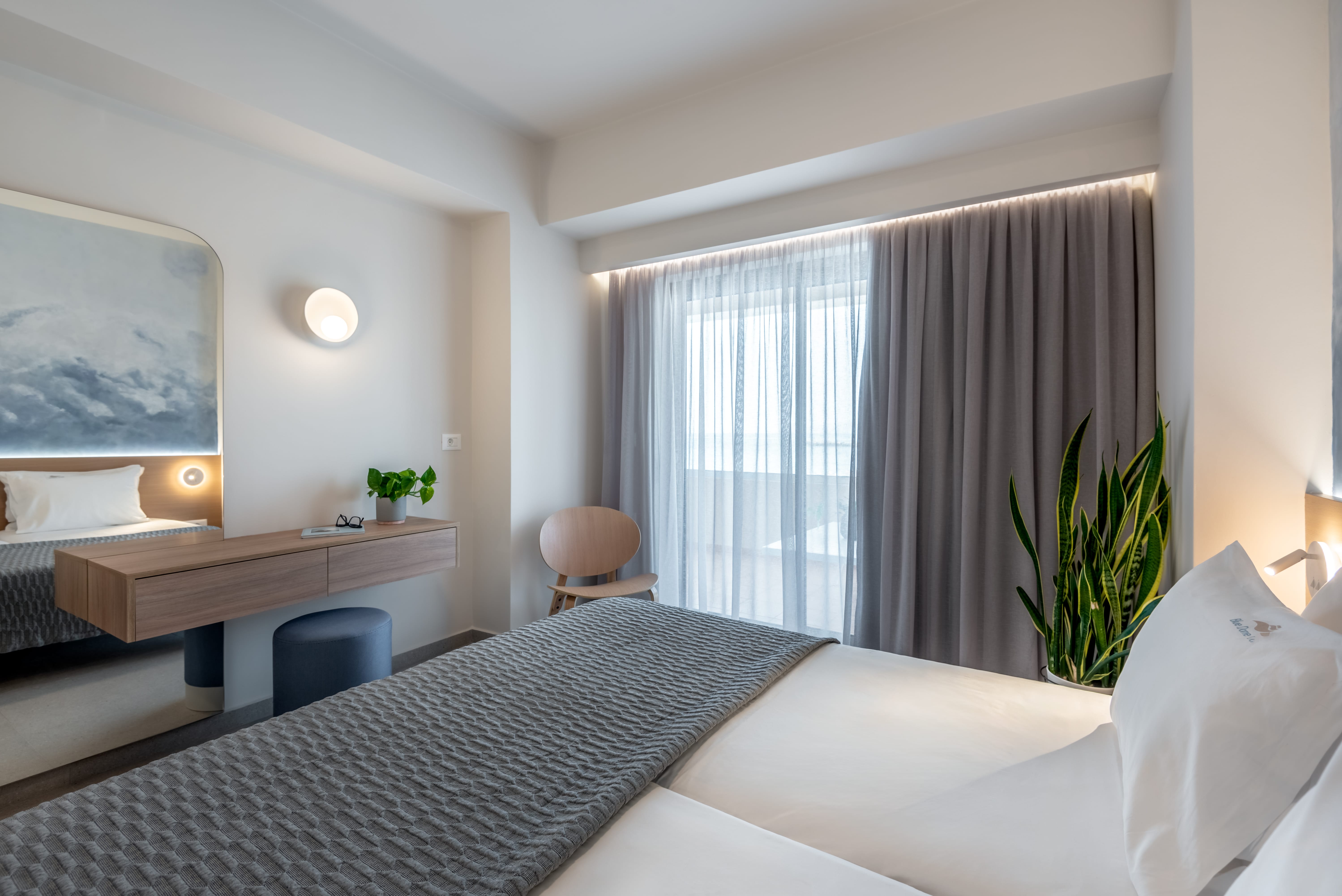 a room with a bed and a desk