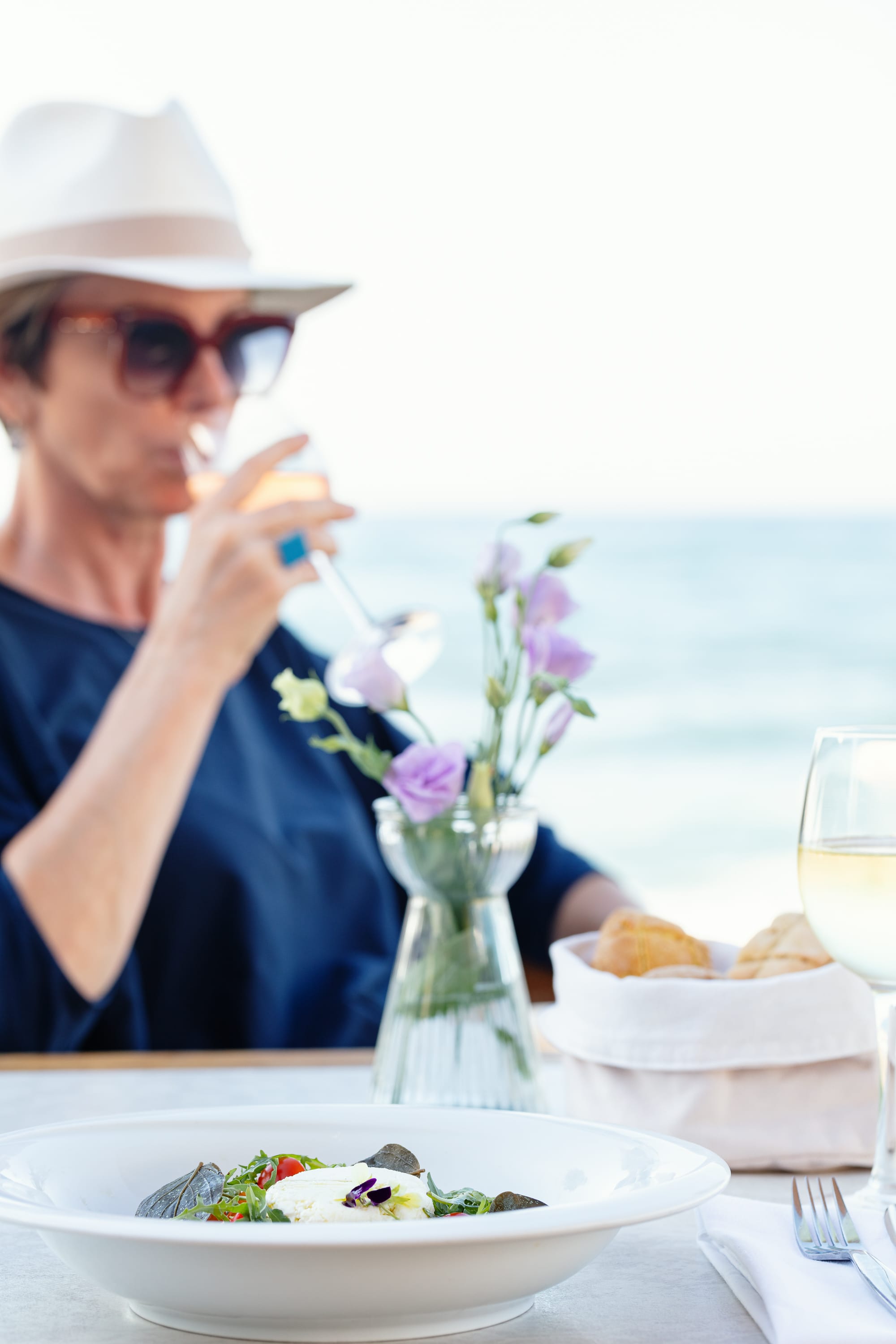 a person in a hat eating a meal