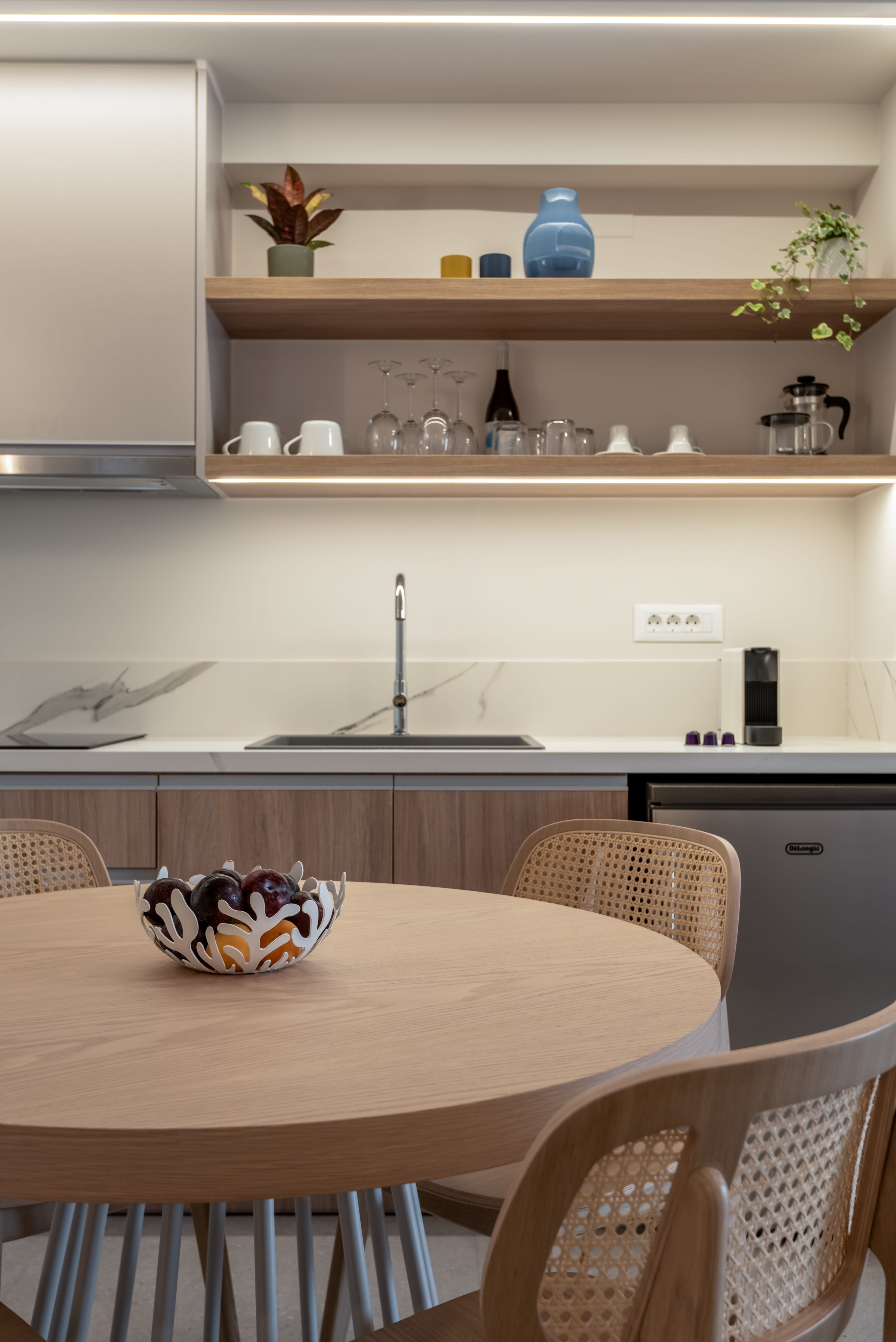 a kitchen with a table and chairs