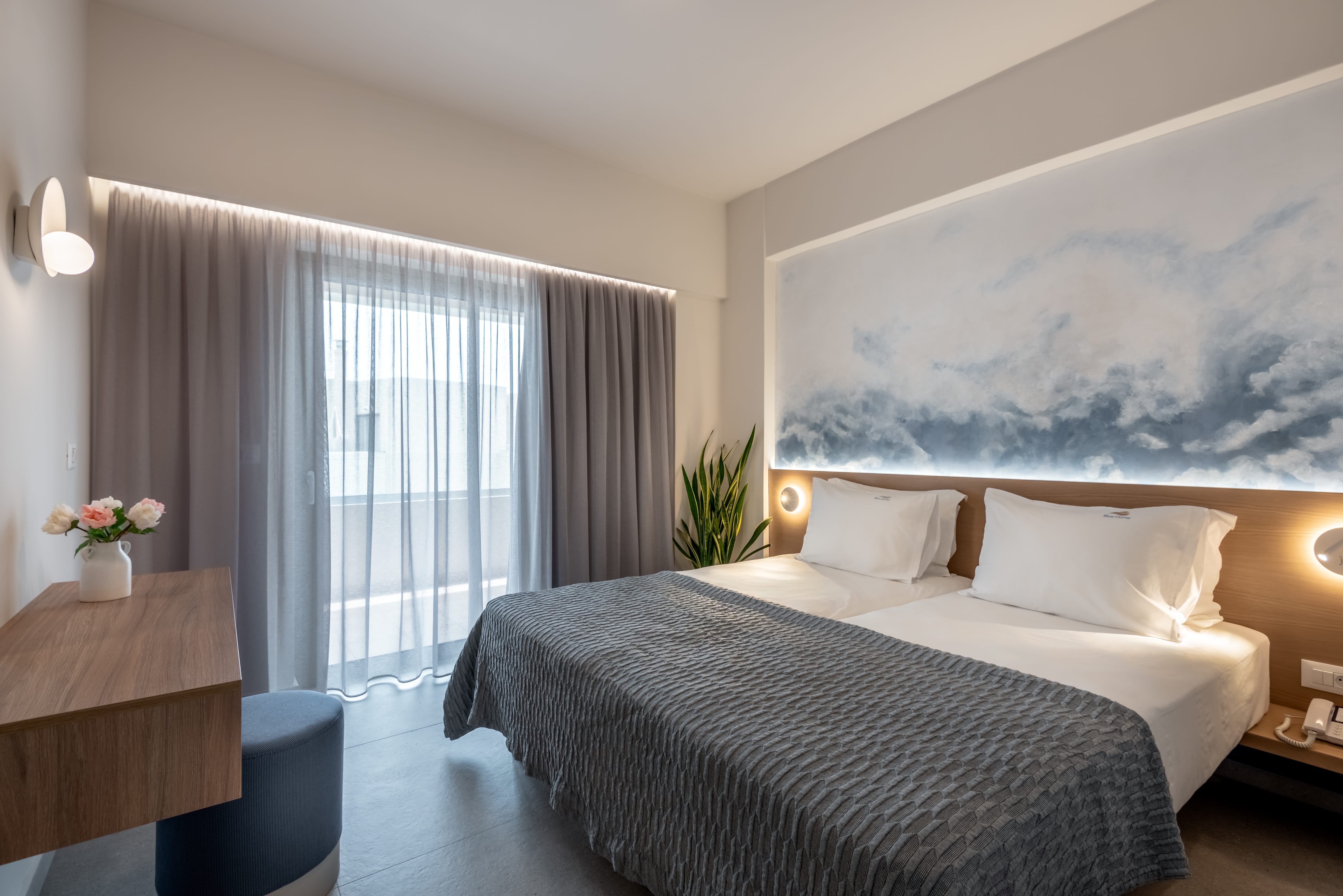 a bedroom with a bed and a table