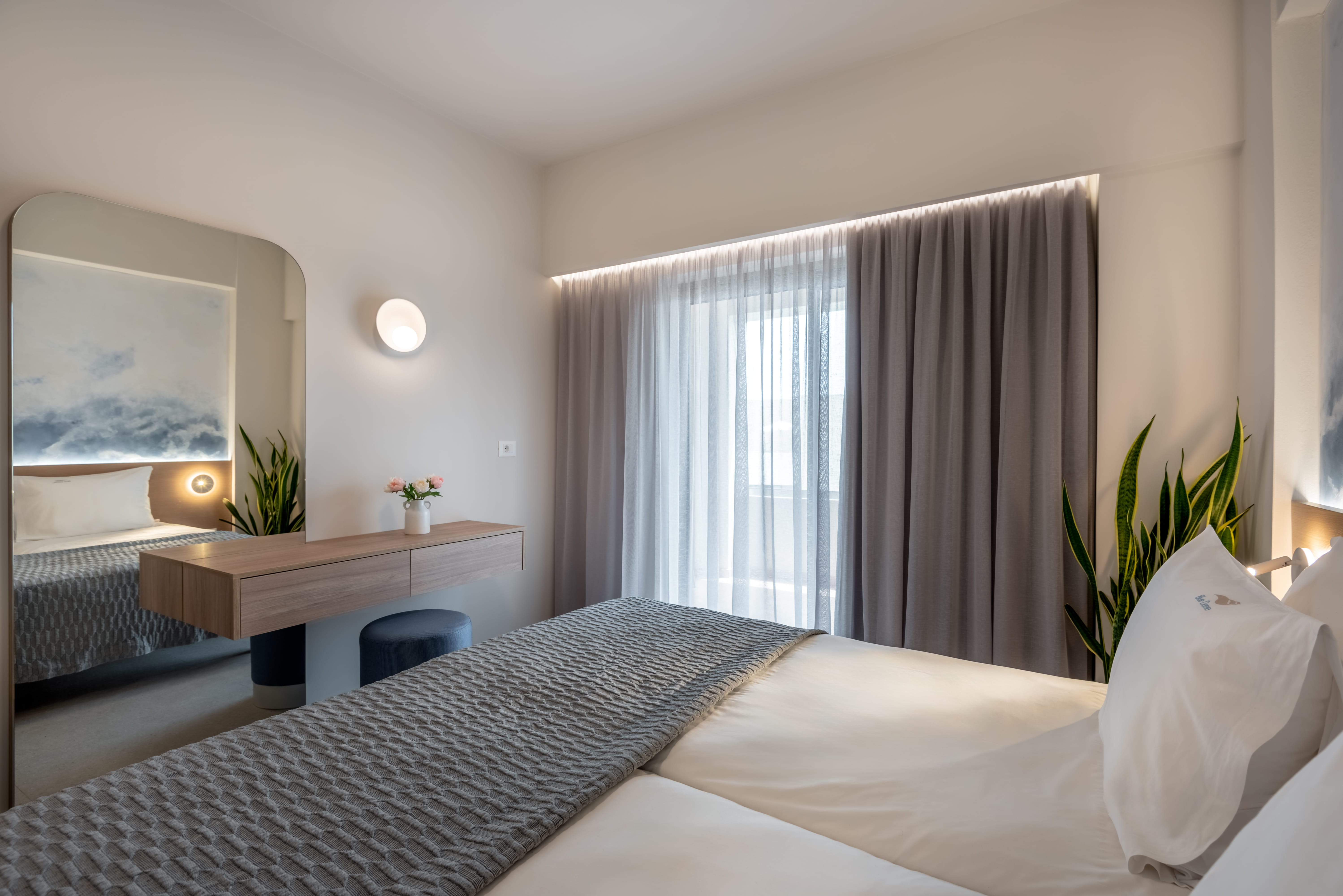 a bedroom with a bed and a desk