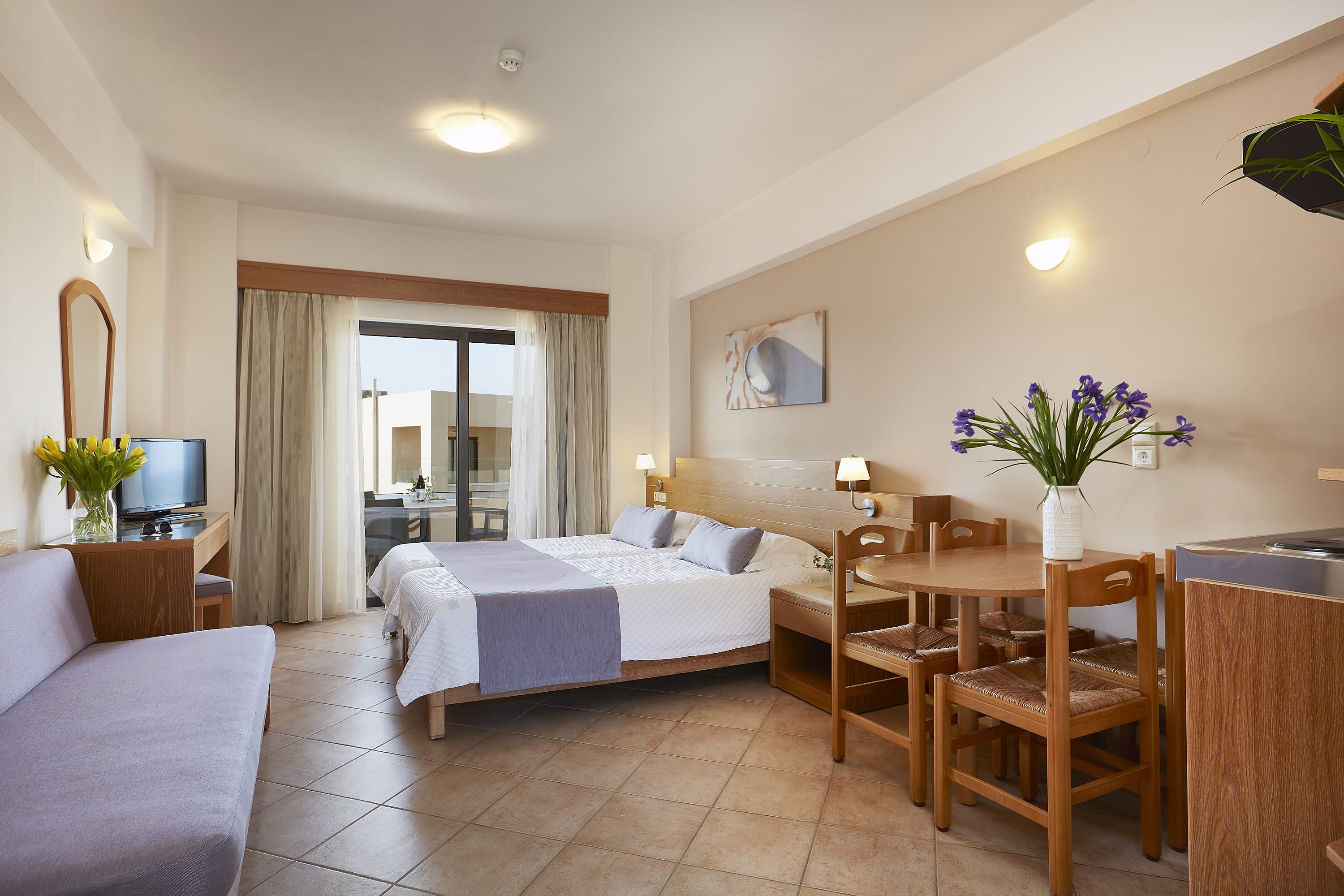 a hotel room with a bed and a table