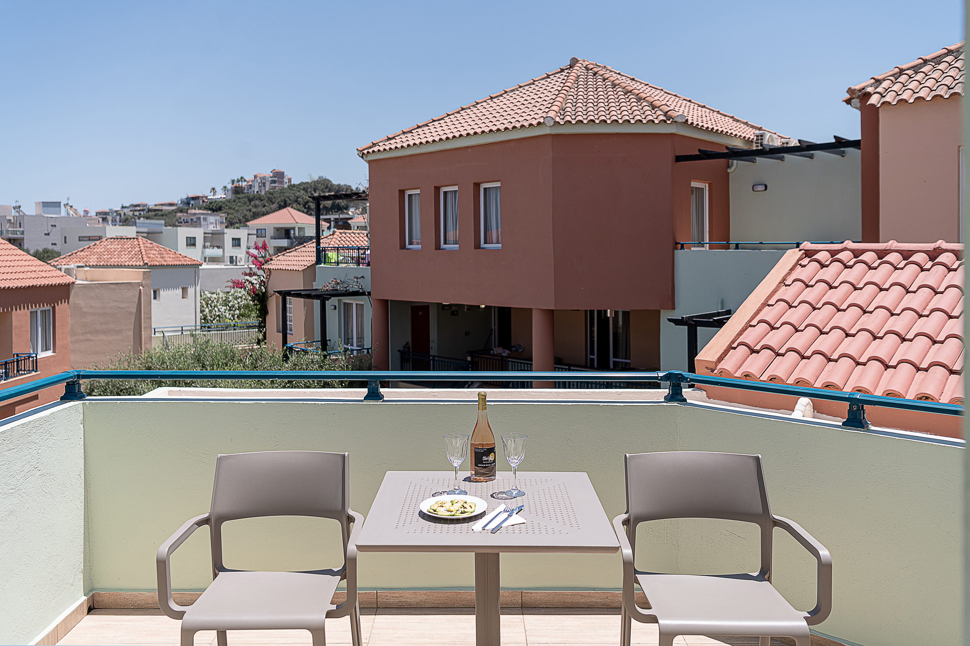 a table and chairs on a balcony