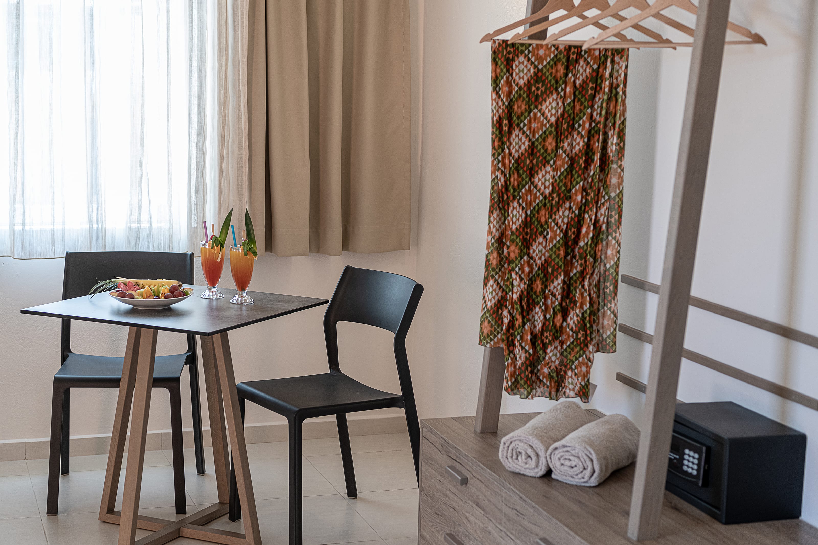 a table with chairs and a window