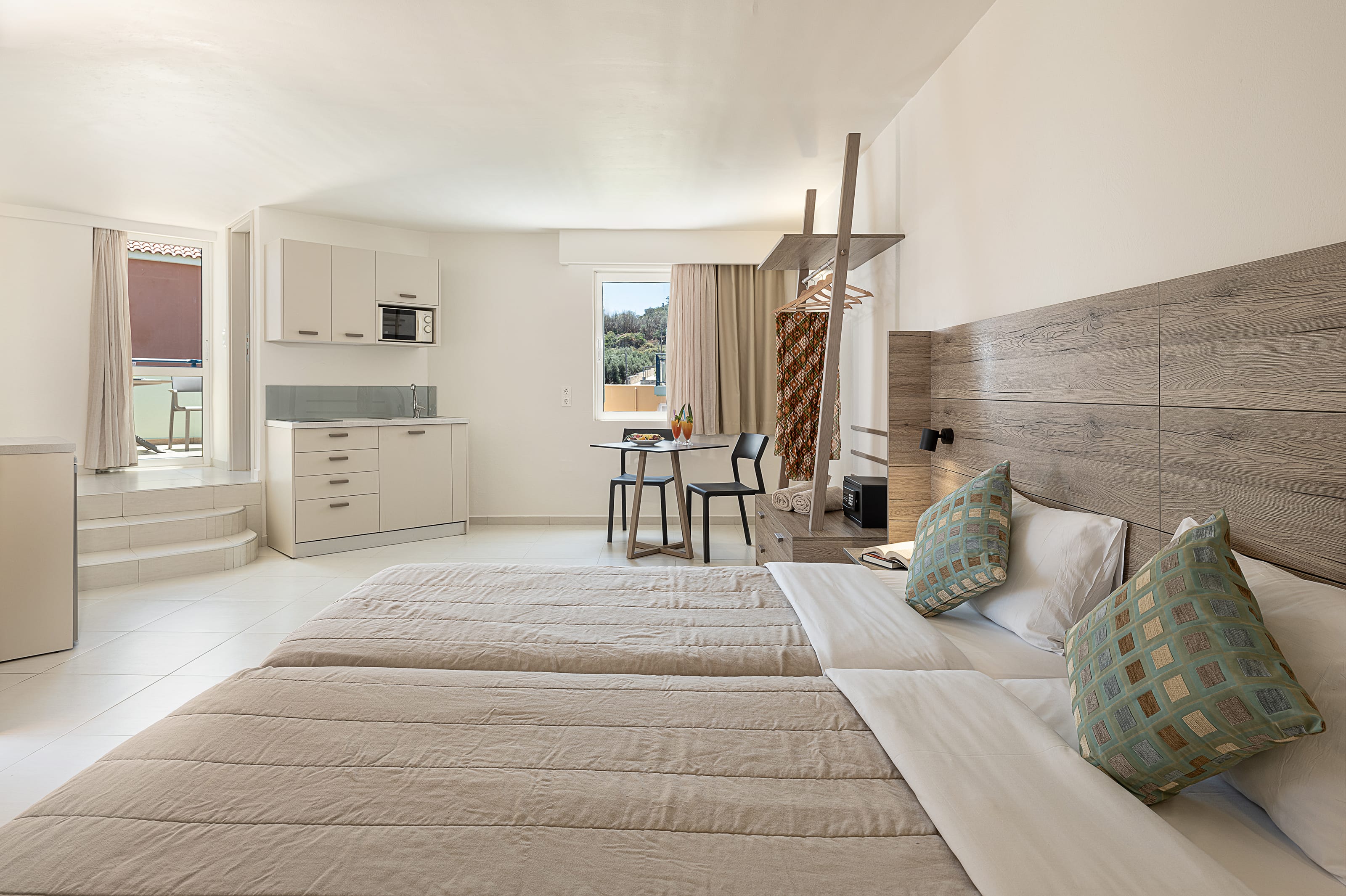 a large living room with a bed and a couch