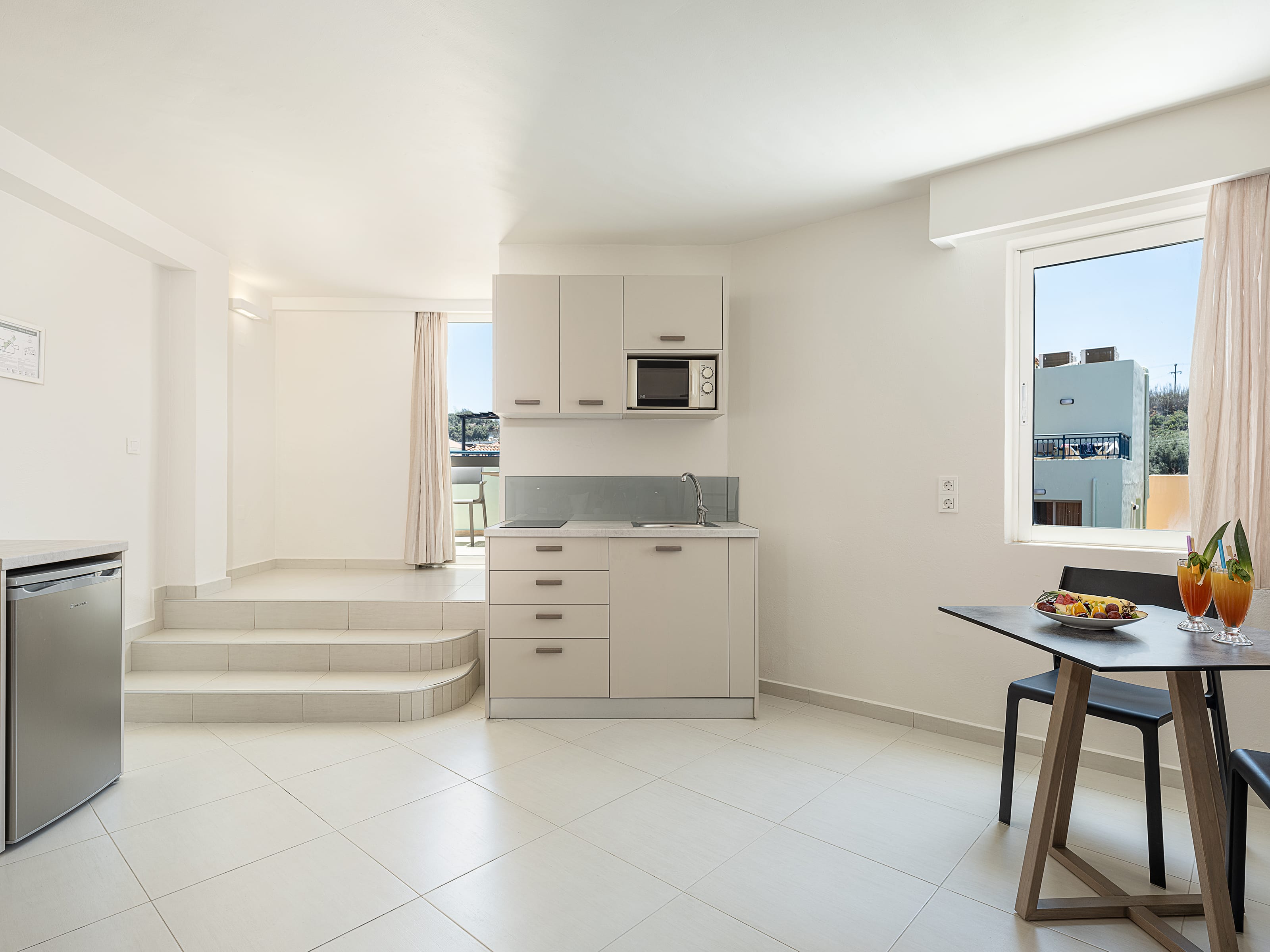 a kitchen with white walls